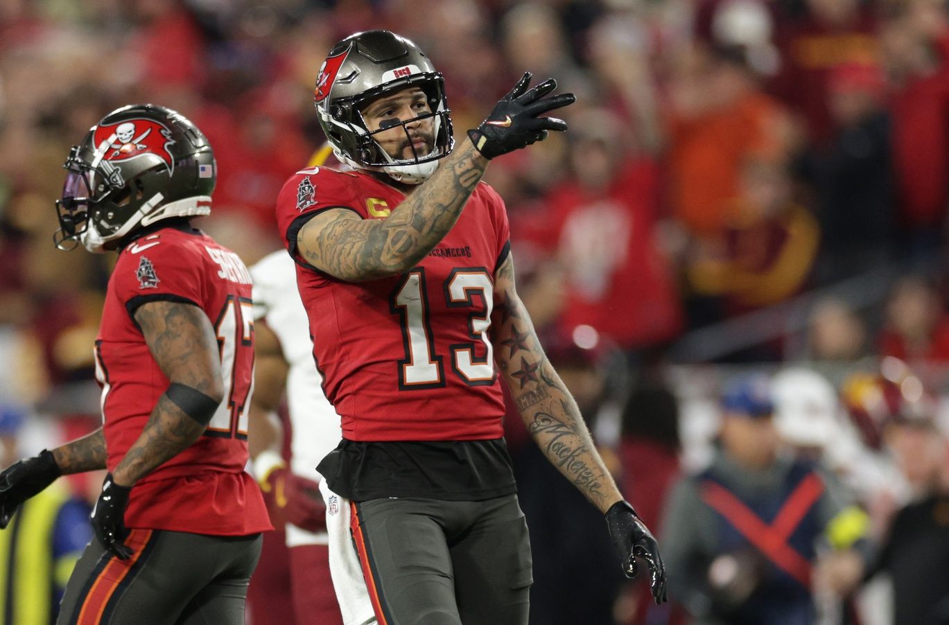 Tampa Bay Buccaneers wide receiver Mike Evans (13) reacts after a first down during the third quarter of a NFC wild card playoff against the Washington Commanders at Raymond James Stadium.
