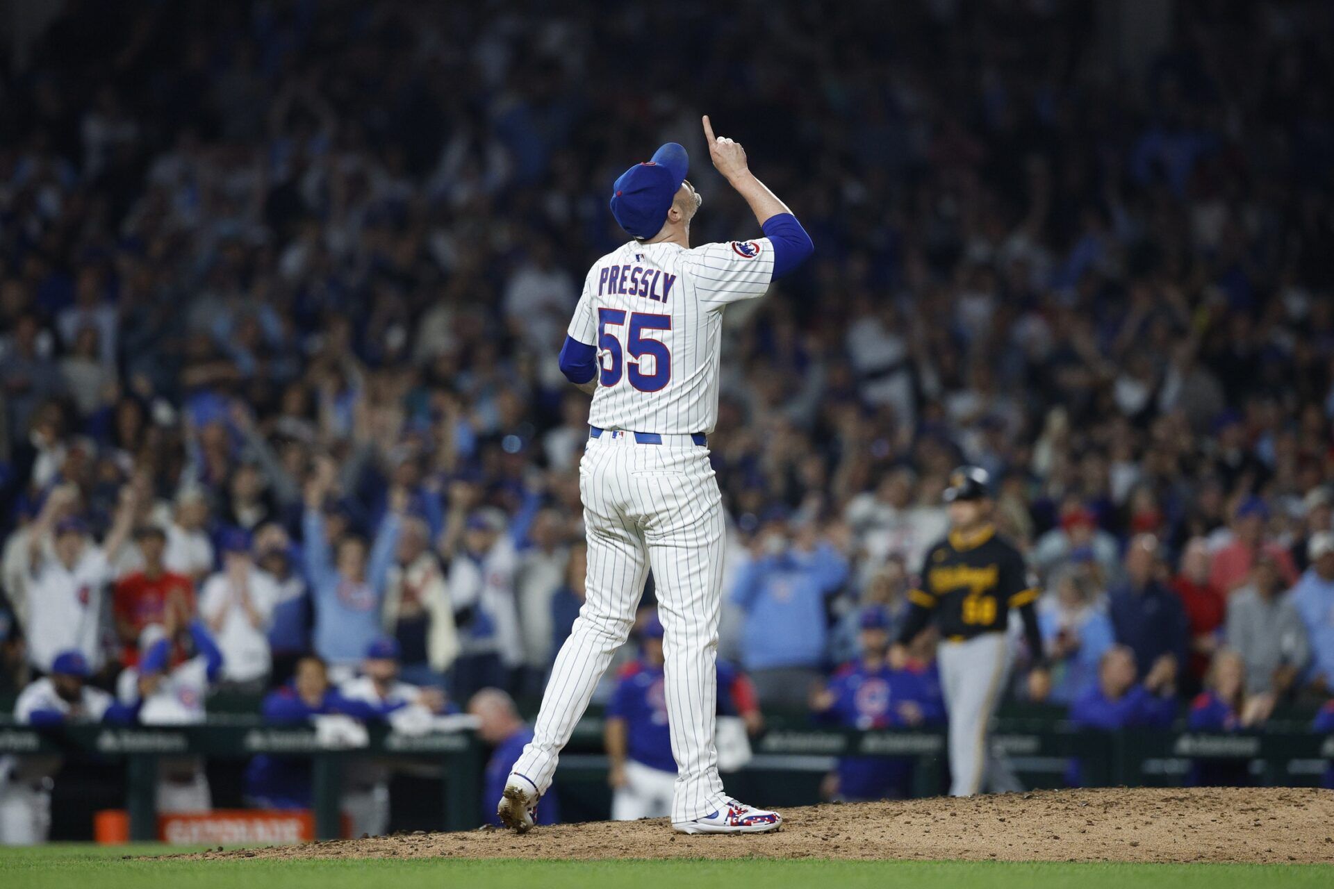 Chicago Cubs relief pitcher Ryan Pressly (55) celebrates a win against the Pittsburgh Pirates at Wrigley Field.