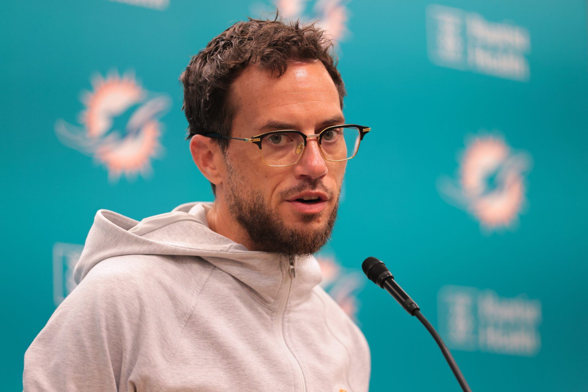 Miami Dolphins head coach Mike McDaniel talks to reporters before practice during mandatory minicamp at Hard Rock Stadium.