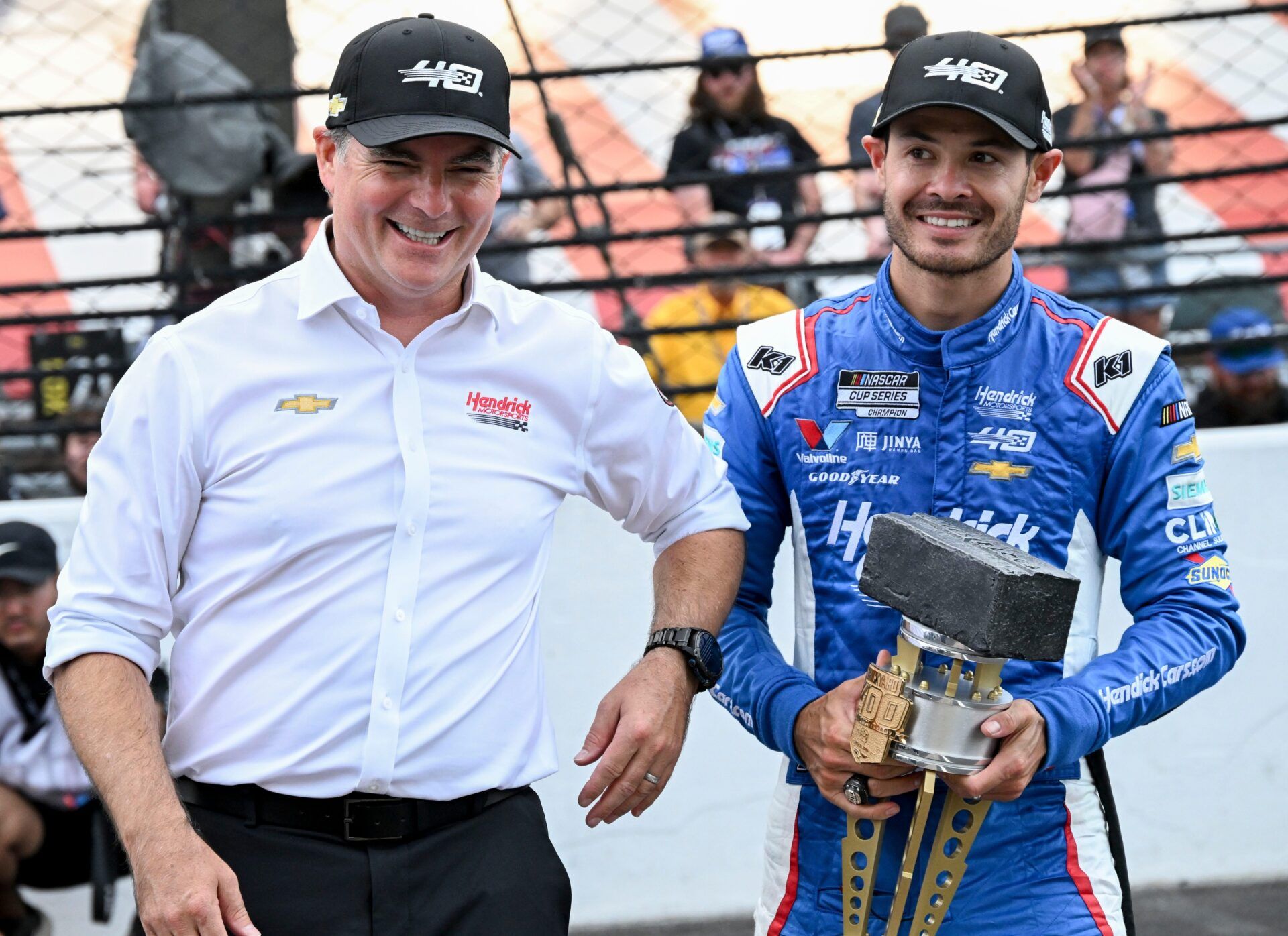 Jeff Gordon celebrates with NASCAR Cup Series driver Kyle Larson (5) after he won the Brickyard 400, Sunday, July 21, 2024, at Indianapolis Motor Speedway.