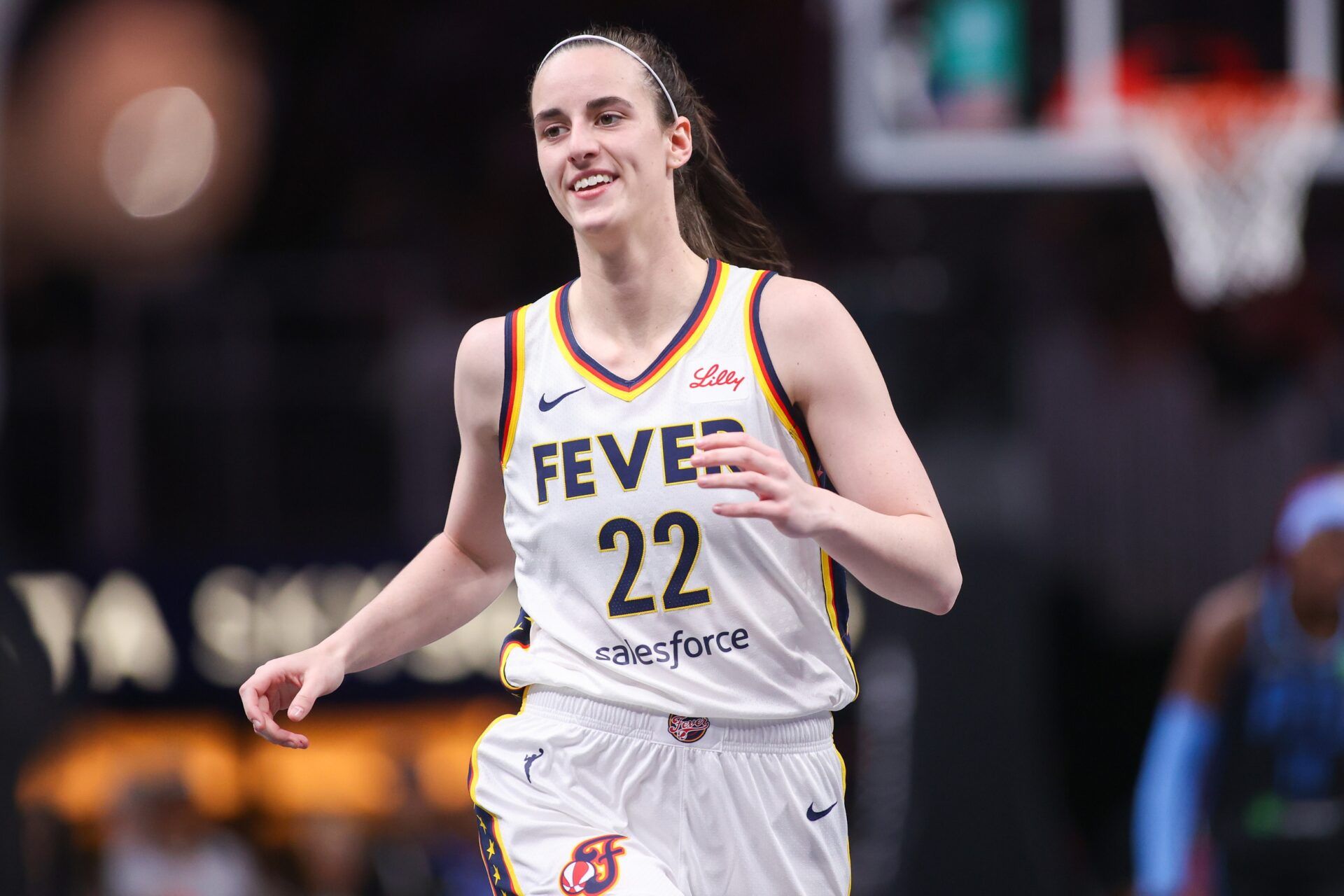 Indiana Fever guard Caitlin Clark (22) reacts after a basket against the Atlanta Dream in the first half at State Farm Arena.