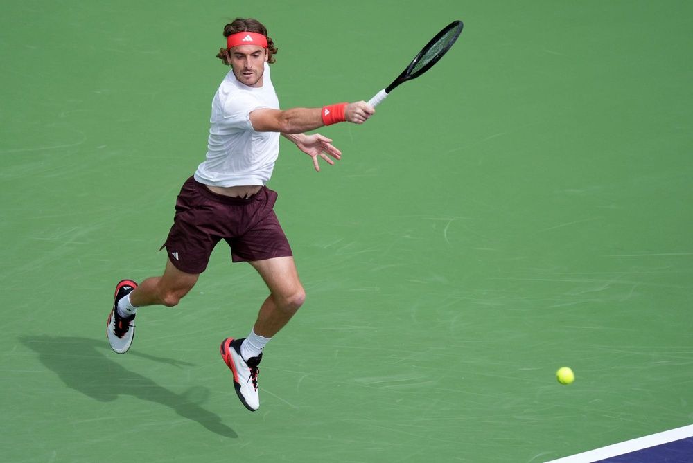 Stefanos Tsitsipas returns to Holger Rune on Stadium 1 during their fourth-round match at the BNP Paribas Open in Indian Wells, Calif., on Tuesday morning, March 11, 2025.