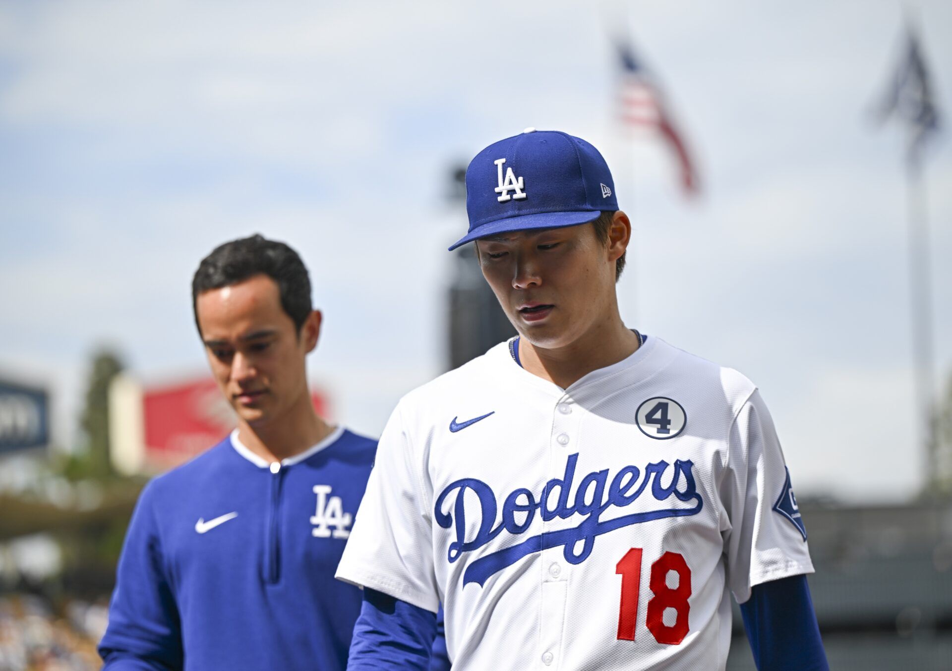 Los Angeles Dodgers starting pitcher Yoshinobu Yamamoto (18) walks to the dugout prior to the game against the New York Yankees at Dodger Stadium.