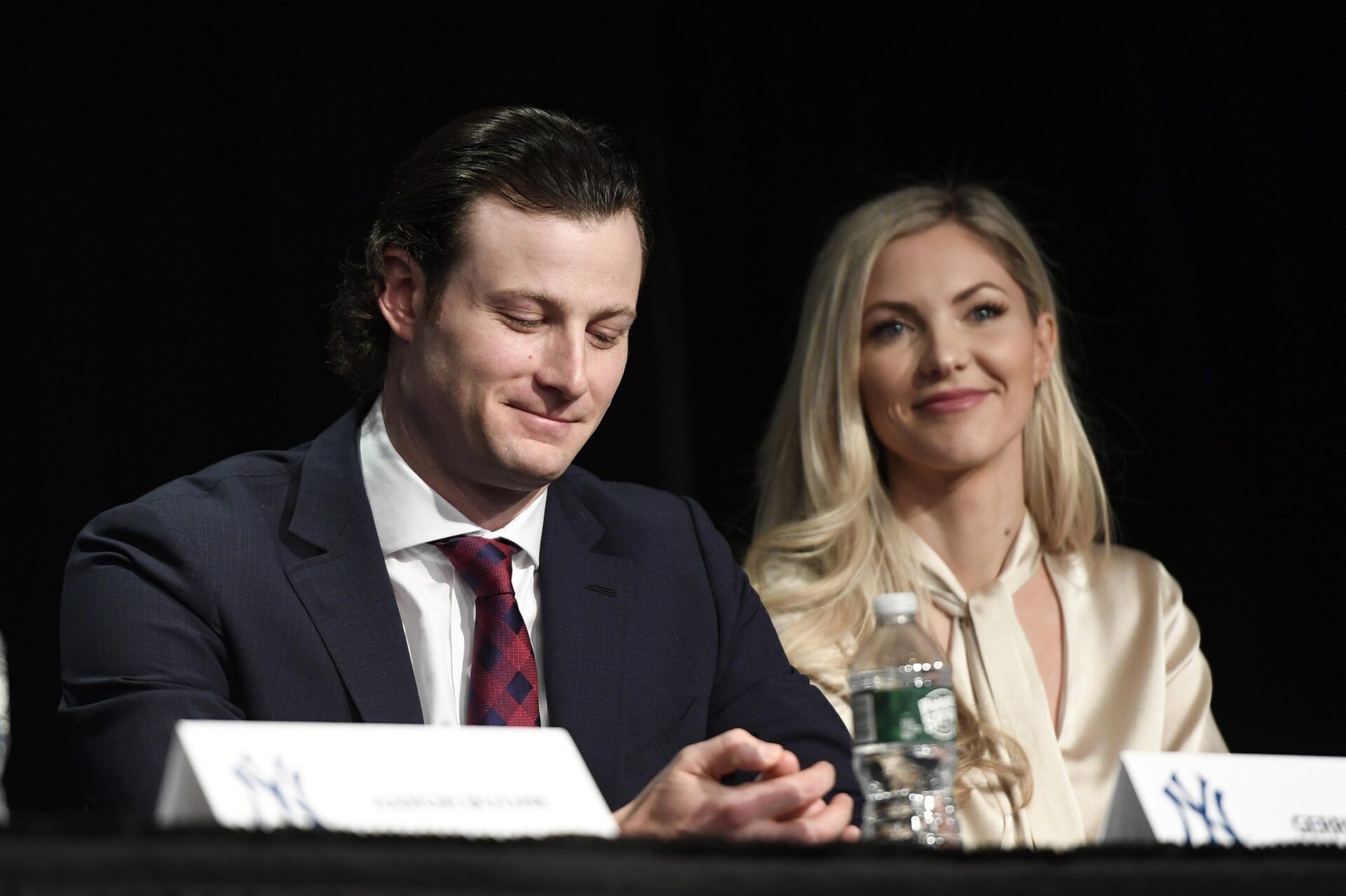 New York Yankees pitcher Gerrit Cole and wife Amy Cole smile as manager Aaron Boone (not pictured) speaks about signing Cole during a press conference at Legends Club at Yankee Stadium.