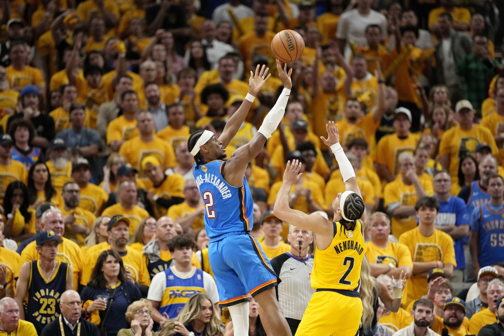 Oklahoma City Thunder guard Shai Gilgeous-Alexander (2) shoots the ball against Indiana Pacers guard Andrew Nembhard (2) during the second half during game four of the 2025 NBA Finals at Gainbridge Fieldhouse.