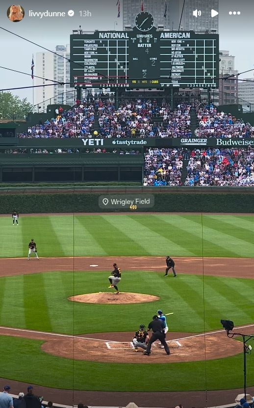 Livvy watching Paul Skenes strike out a Cubs batter at Wrigley Field