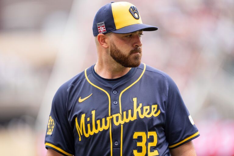 Milwaukee Brewers pitcher Aaron Civale (32) walks to the dugout after the fourth inning against the Minnesota Twins at Target Field.