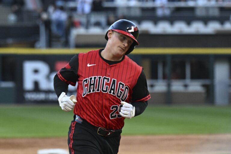 Chicago White Sox first base Andrew Vaughn (25) runs the bases after hitting a home run during the second inning at Rate Field.