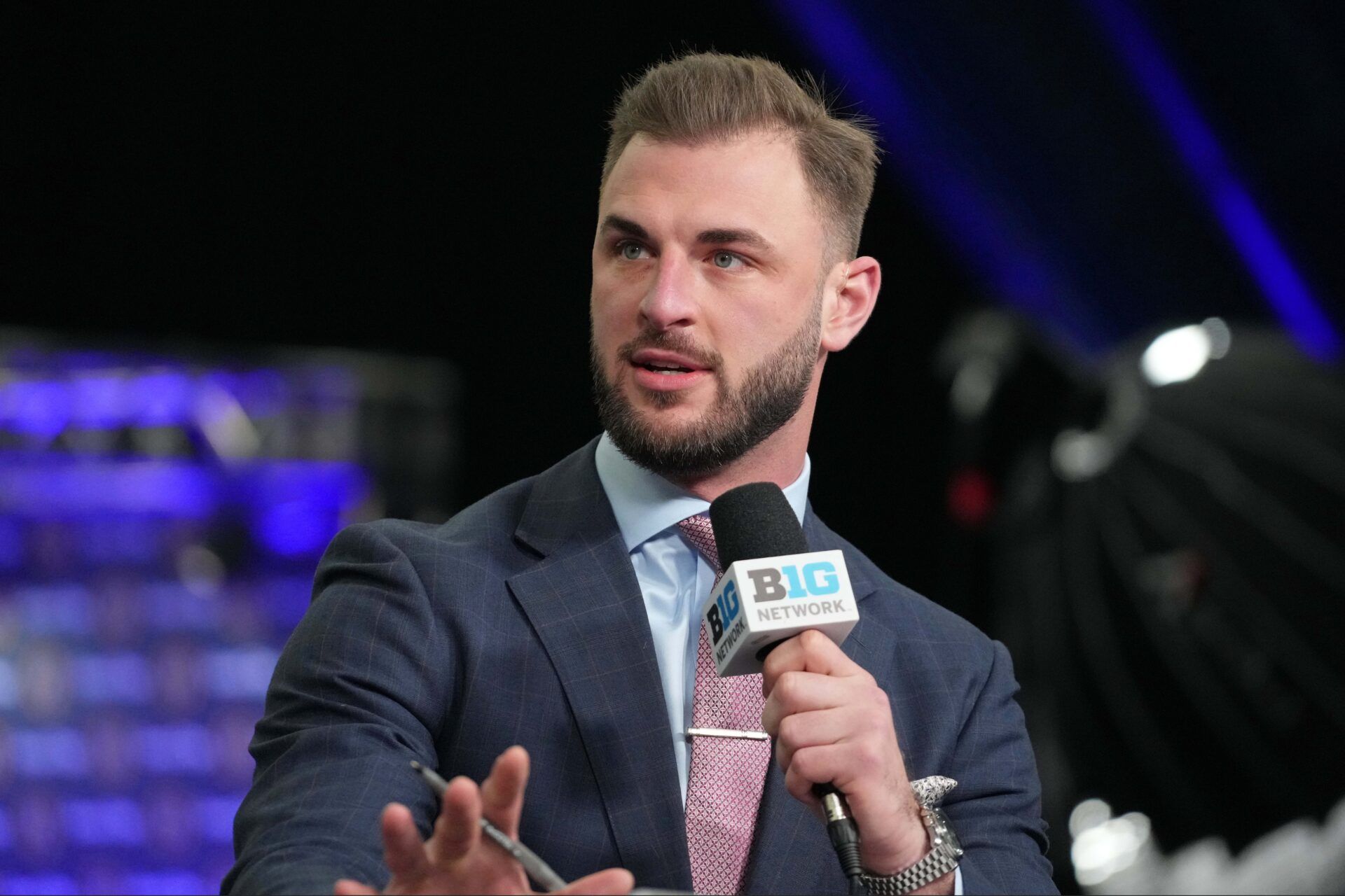 Michigan Wolverines former player Jake Butt talks on the Big Ten Network set  during media day before the College Football Playoff national championship game against the Washington Huskies at George R Brown Convention Center.