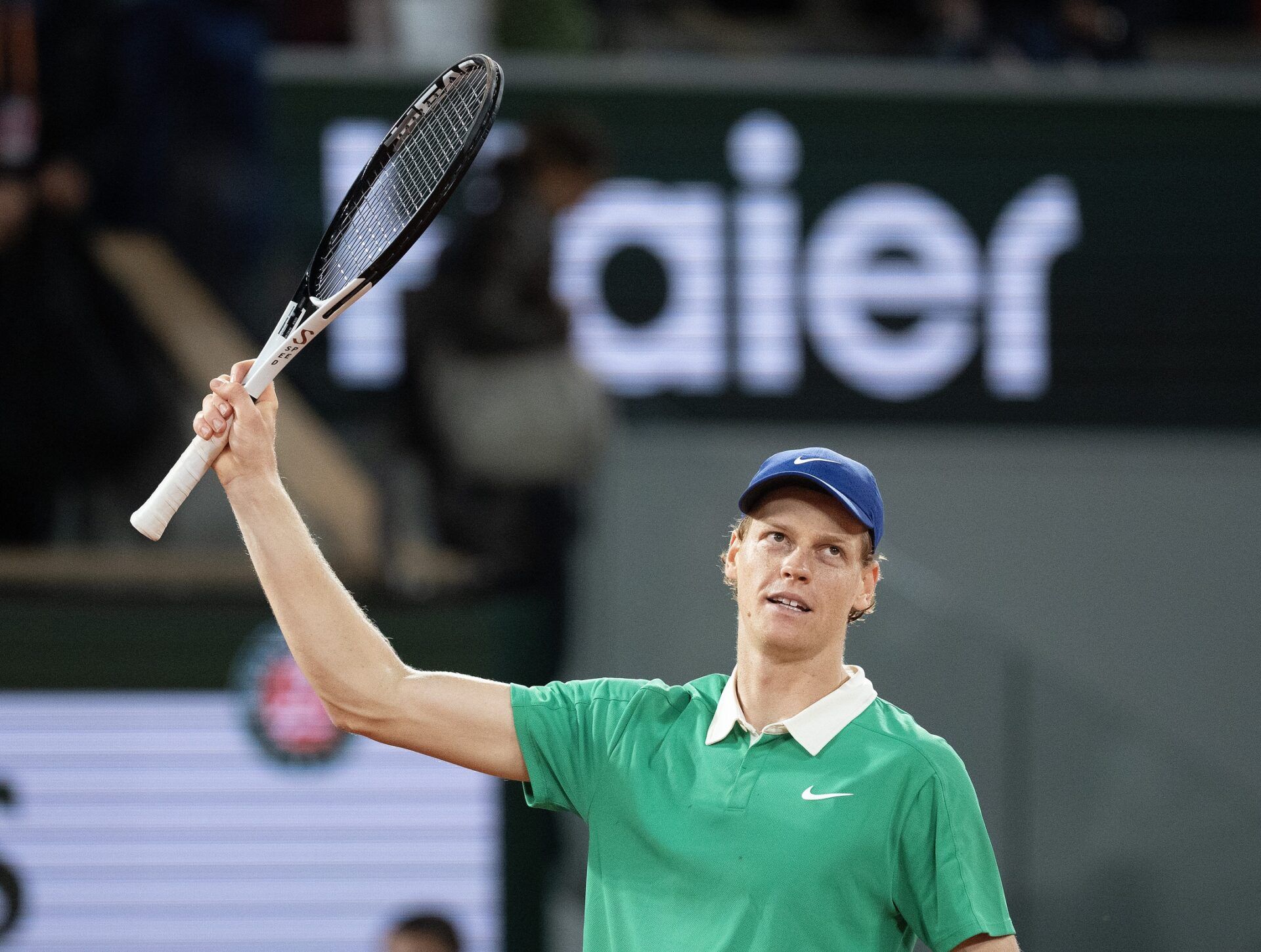 Jannik Sinner of Italy celebrates winning his match against Novak Djokovic of Serbia on day 13 at Roland Garros Stadium.