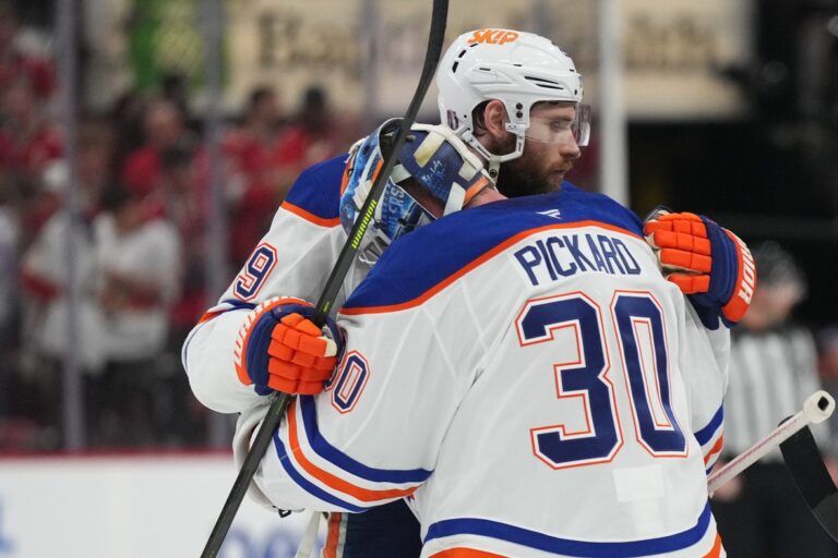Edmonton Oilers center Leon Draisaitl (29) celebrates the win with goaltender Calvin Pickard (30) after overtime against the Florida Panthers in game four of the 2025 Stanley Cup Final at Amerant Bank Arena.