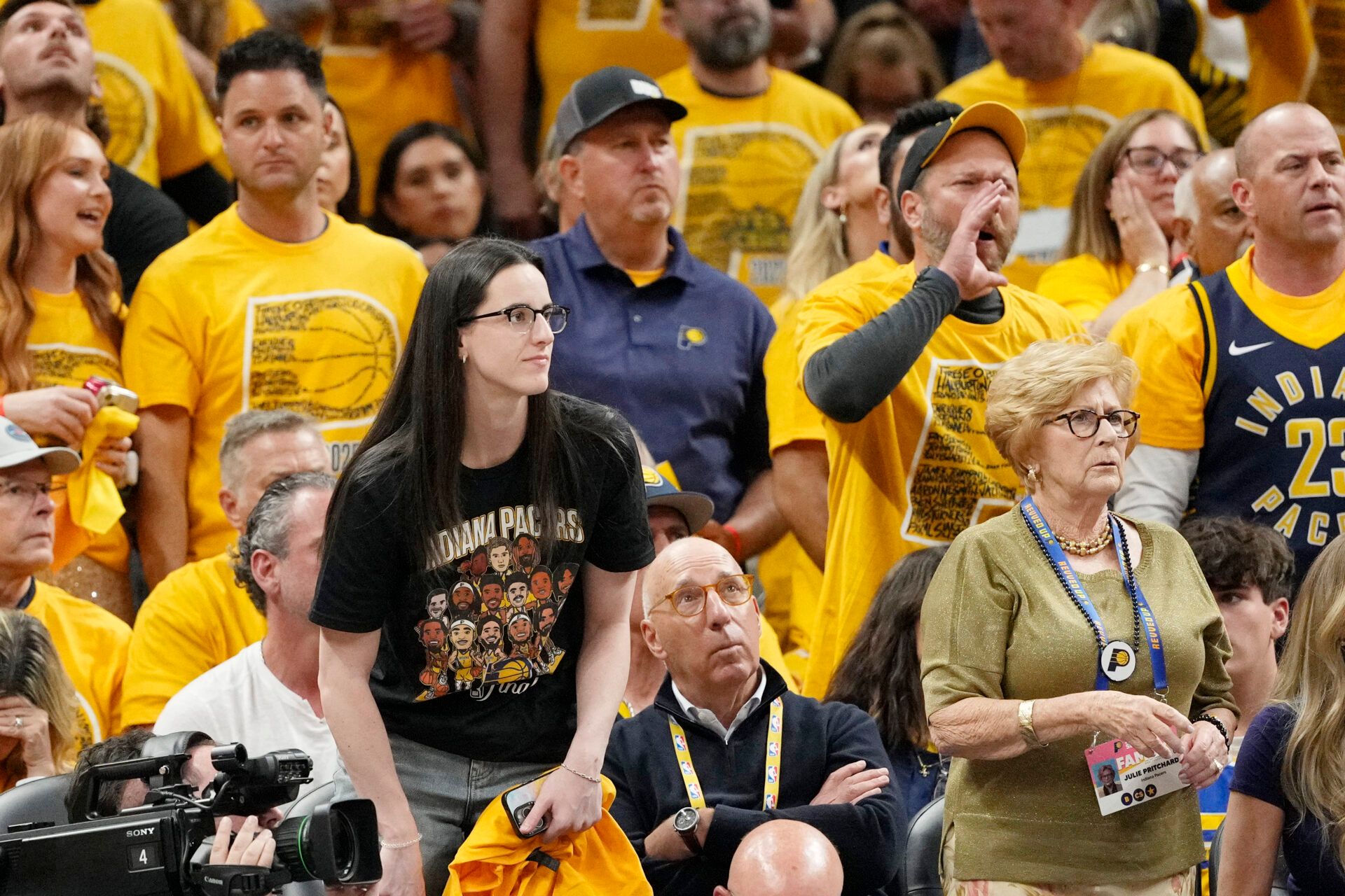 Caitlin Clark looks on during the first half during game four of the 2025 NBA Finals between the Oklahoma City Thunder and the Indiana Pacers at Gainbridge Fieldhouse.
