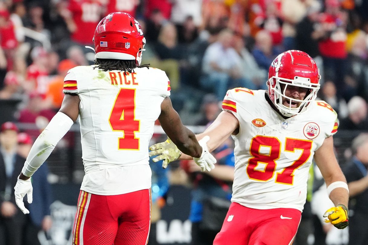 Kansas City Chiefs wide receiver Rashee Rice (4) celebrates with Kansas City Chiefs tight end Travis Kelce (87) after scoring a touchdown against the Las Vegas Raiders during the fourth quarter at Allegiant Stadium.