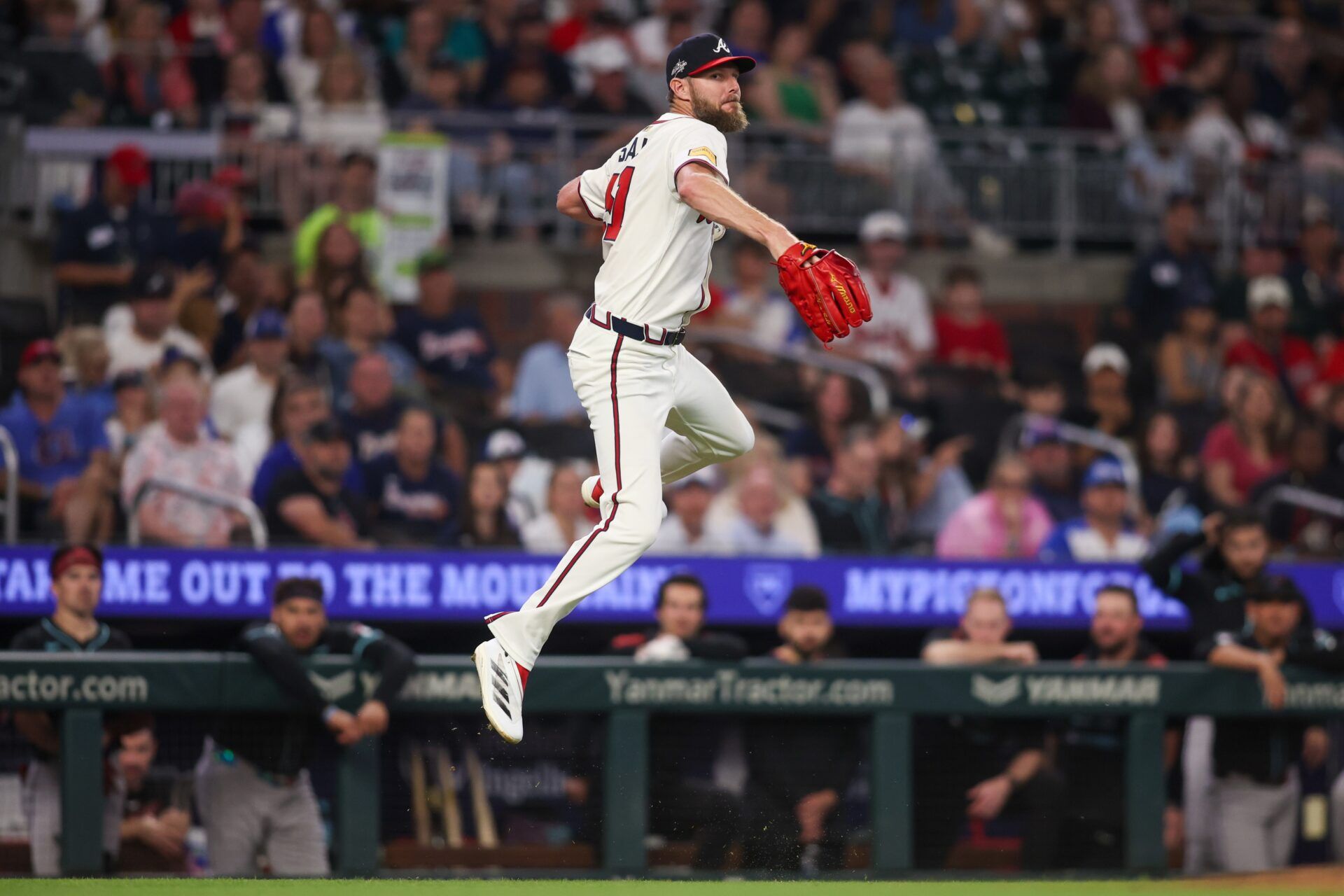 Atlanta Braves starting pitcher Chris Sale (51) looks to throw to first against the Arizona Diamondbacks in the fifth inning at Truist Park.