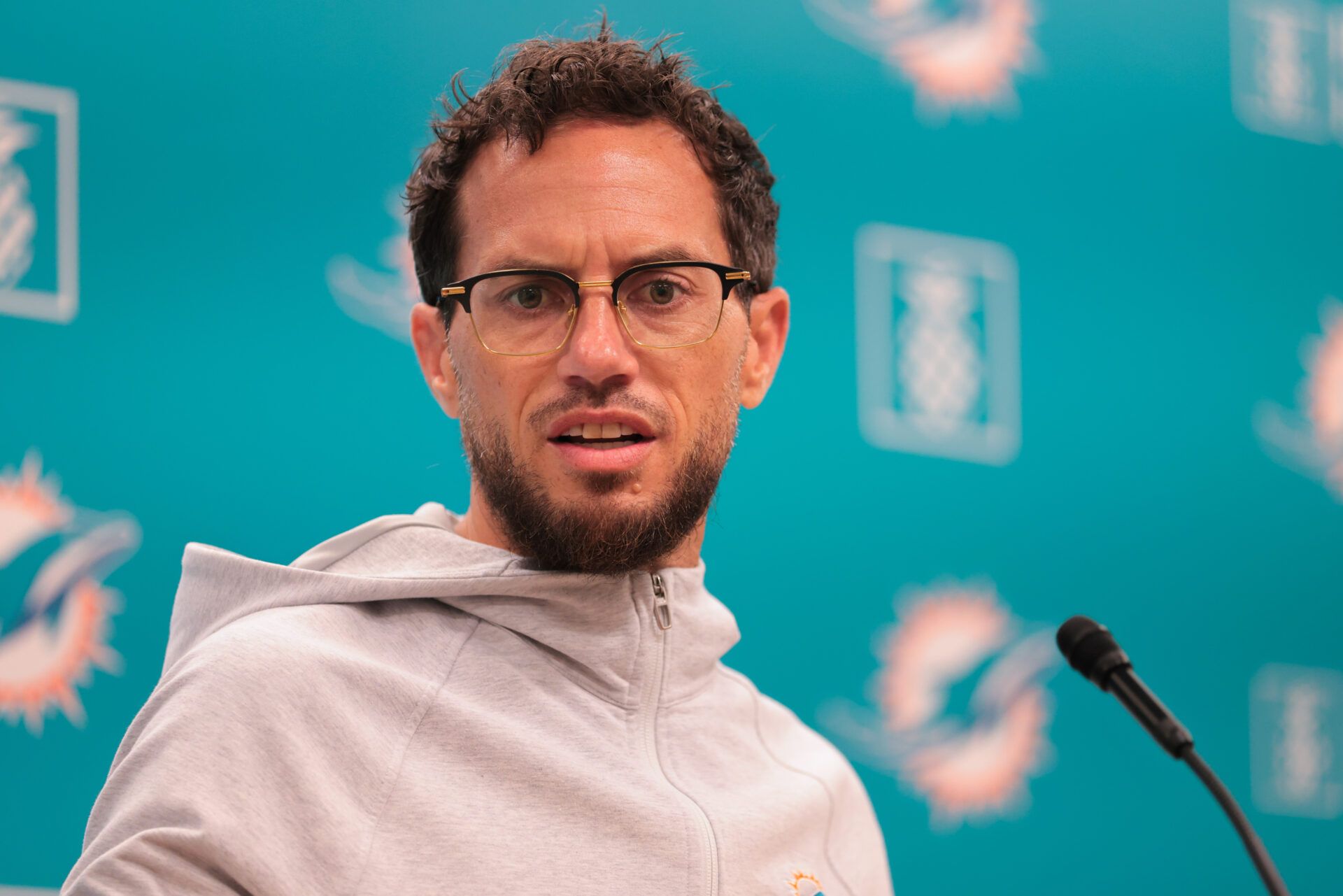 Miami Dolphins head coach Mike McDaniel talks to reporters before practice during mandatory minicamp at Hard Rock Stadium.