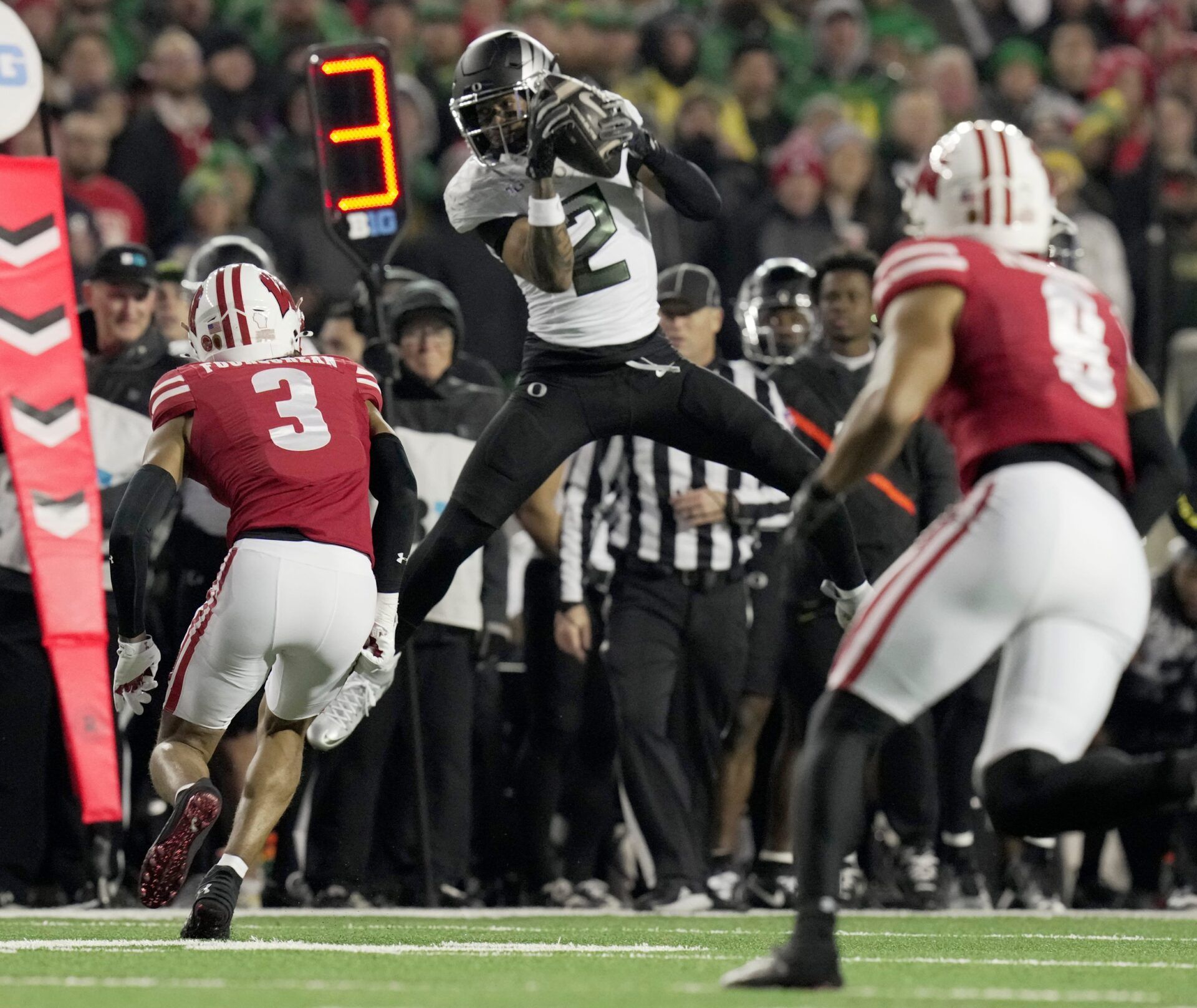 Oregon wide receiver Gary Bryant Jr. (2) makes a catch just short of a first down during the second quarter of their game against Wisconsin Saturday, November 16, 2024 at Camp Randall Stadium in Madison, Wisconsin.