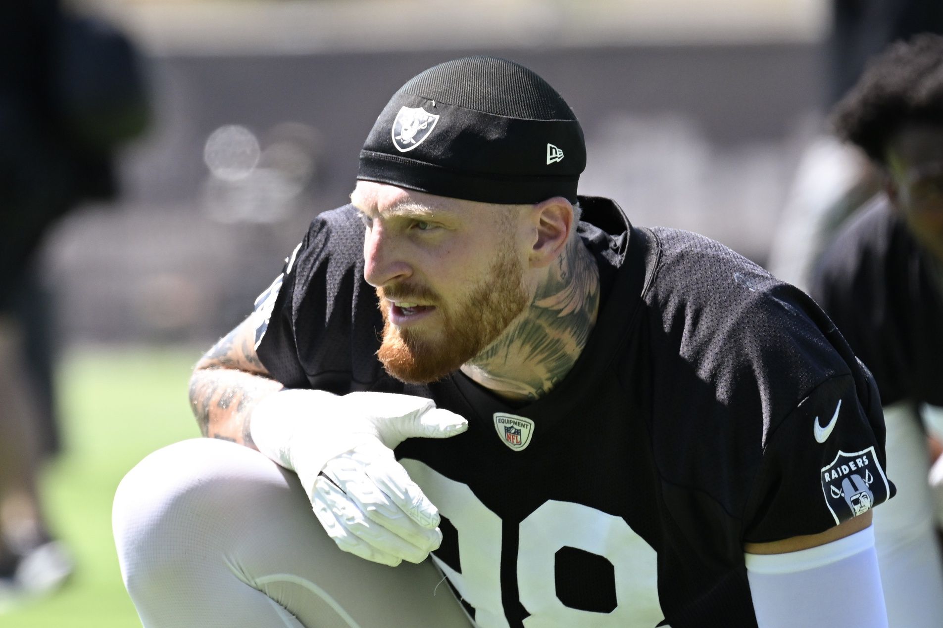 Las Vegas Raiders defensive end Maxx Crosby (98) looks on during the team stretch during Las Vegas Raiders Minicamp at Intermountain Health Performance Center.