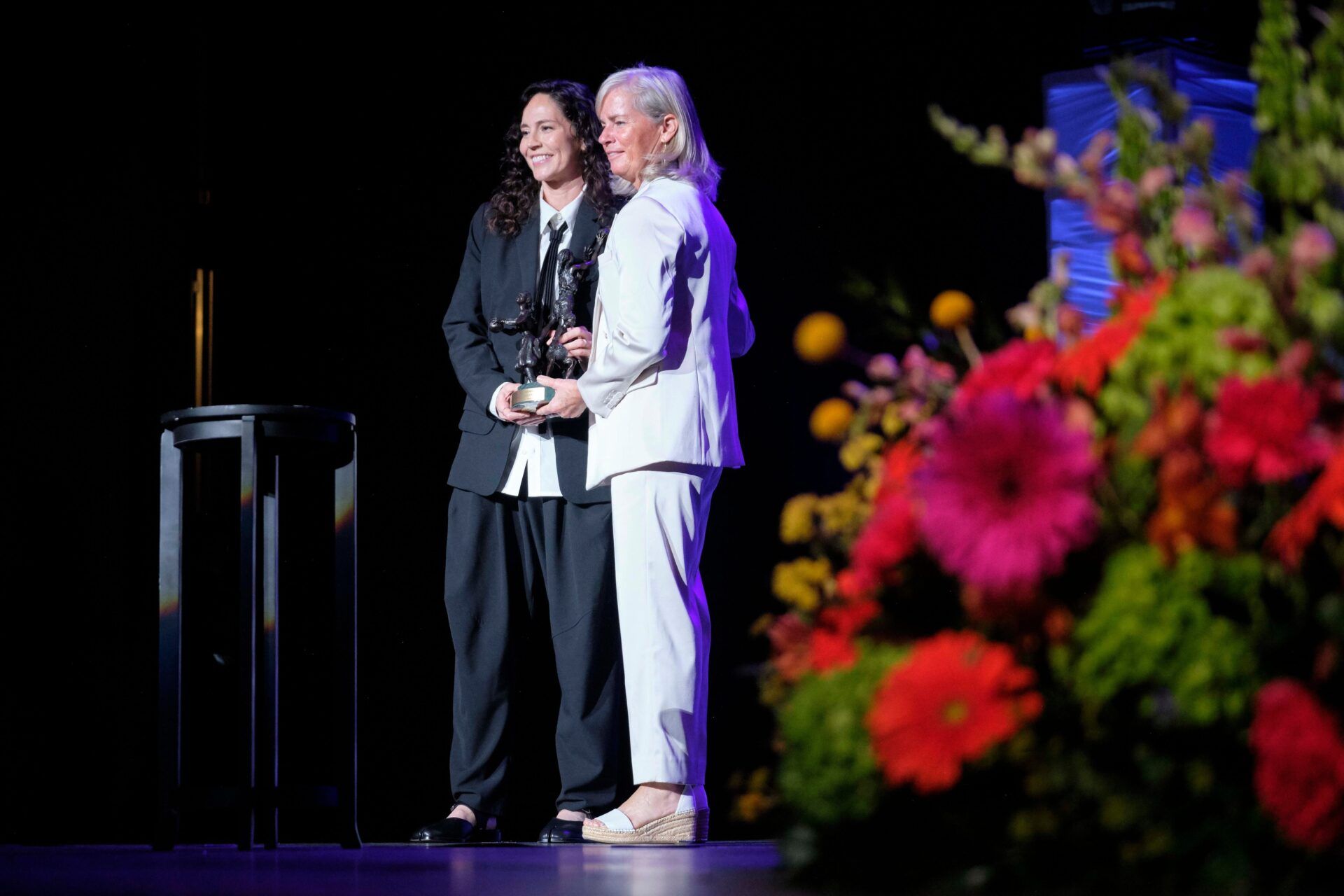 Women's Basketball Hall of Fame Inductee, Sue Bird, receives the Berenson Trophy from Kristen Hughes, Smith College Athletic Director, during the 2025 Women’s Basketball Hall of Fame Induction Ceremony at the Tennessee Theatre, June 14, 2025, in Knoxville, Tenn. (Shawn Millsaps/Special to News Sentinel)