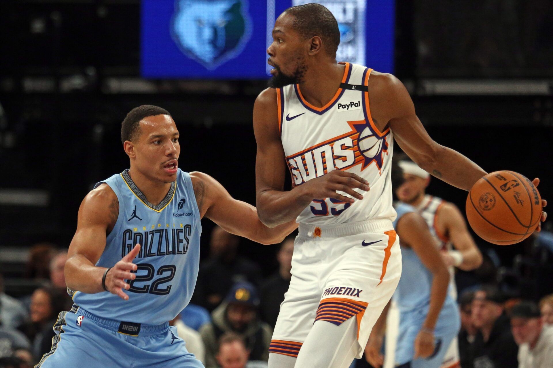 Phoenix Suns forward Kevin Durant (35) handles the ball as Memphis Grizzlies guard Desmond Bane (22) defends during the first quarter at FedExForum.