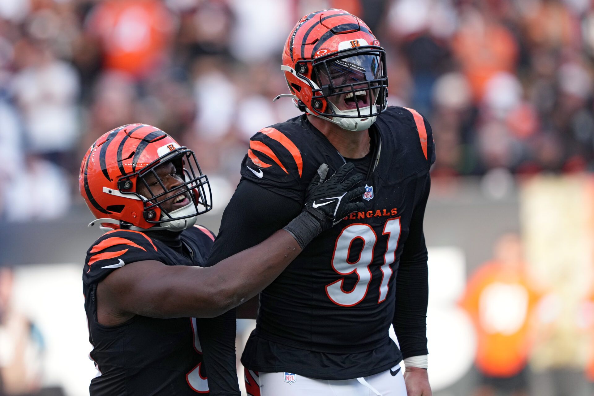 CINCINNATI, OHIO - NOVEMBER 03: Myles Murphy #99 and Trey Hendrickson #91 celebrate after Hendrickson's sack in the fourth quarter of a game against the Las Vegas Raiders at Paycor Stadium on November 03, 2024 in Cincinnati, Ohio. (Photo by Dylan Buell/Getty Images)