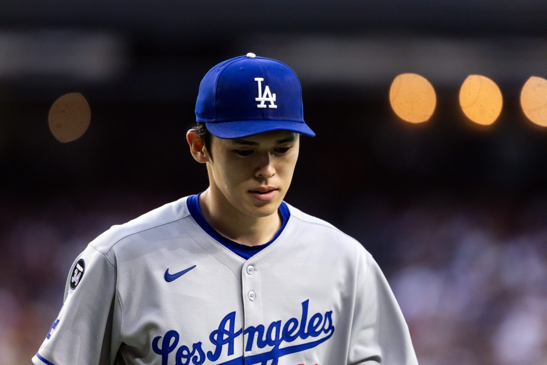 Los Angeles Dodgers pitcher Roki Sasaki (11) reacts against the Arizona Diamondbacks at Chase Field.