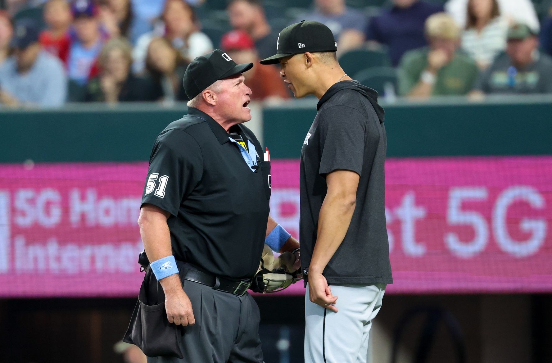 Chicago White Sox manager Will Venable (1) argues with home plate umpire Marvin Hudson (51) during the first inning against the Texas Rangers at Globe Life Field.