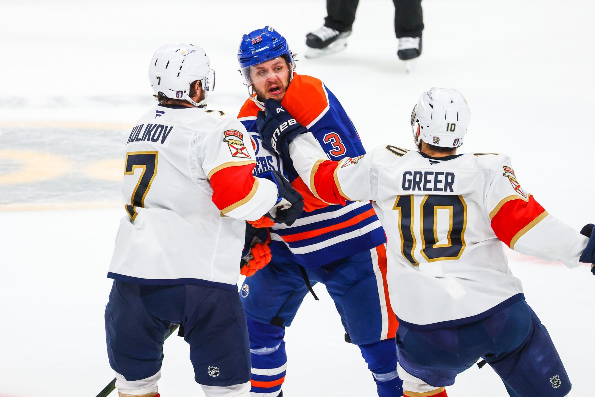 Edmonton Oilers center Mattias Janmark (13) and Florida Panthers left wing A.J. Greer (10) gets into a scrum during the third period in game five of the 2025 Stanley Cup Final at Rogers Place.