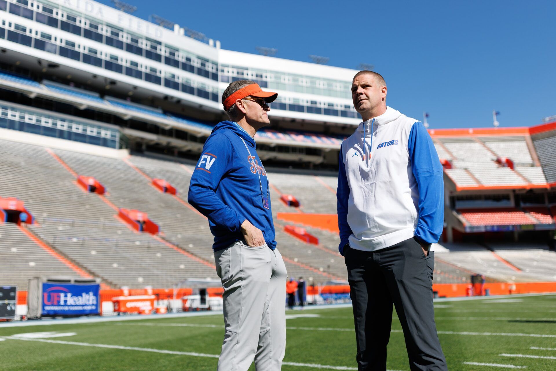 Florida Gators athletic director Scott Stricklin and Florida Gators head coach Billy Napier talk before the game at Ben Hill Griffin Stadium.
