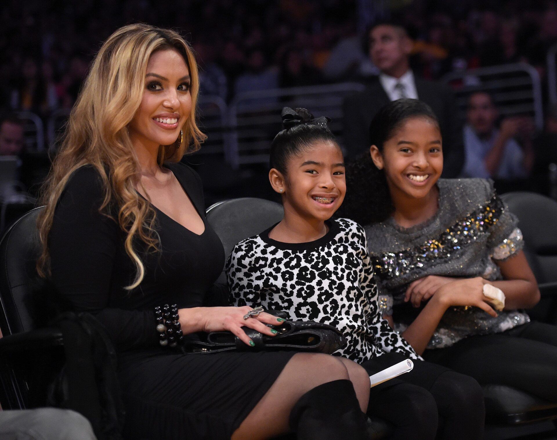 Vanessa Bryant (L) and children Gianna Bryant (C) and Natalia Bryant  (R)attend the game between the Oklahoma City Thunder and the Los Angeles Lakers at Staples Center.
