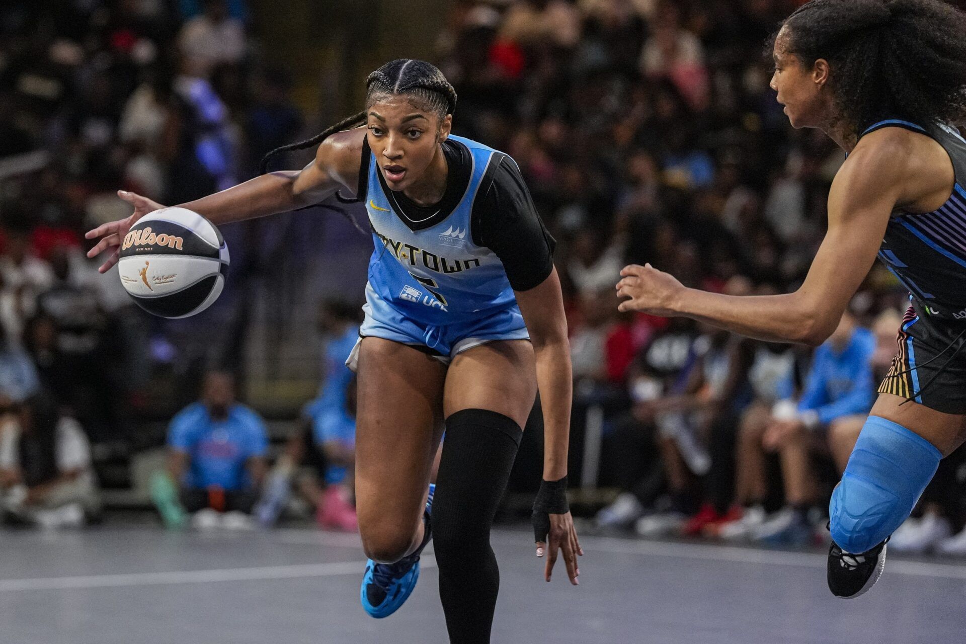 Chicago Sky forward Angel Reese (5) dribbles against the Atlanta Dream during the first half at Gateway Center Arena at College Park.