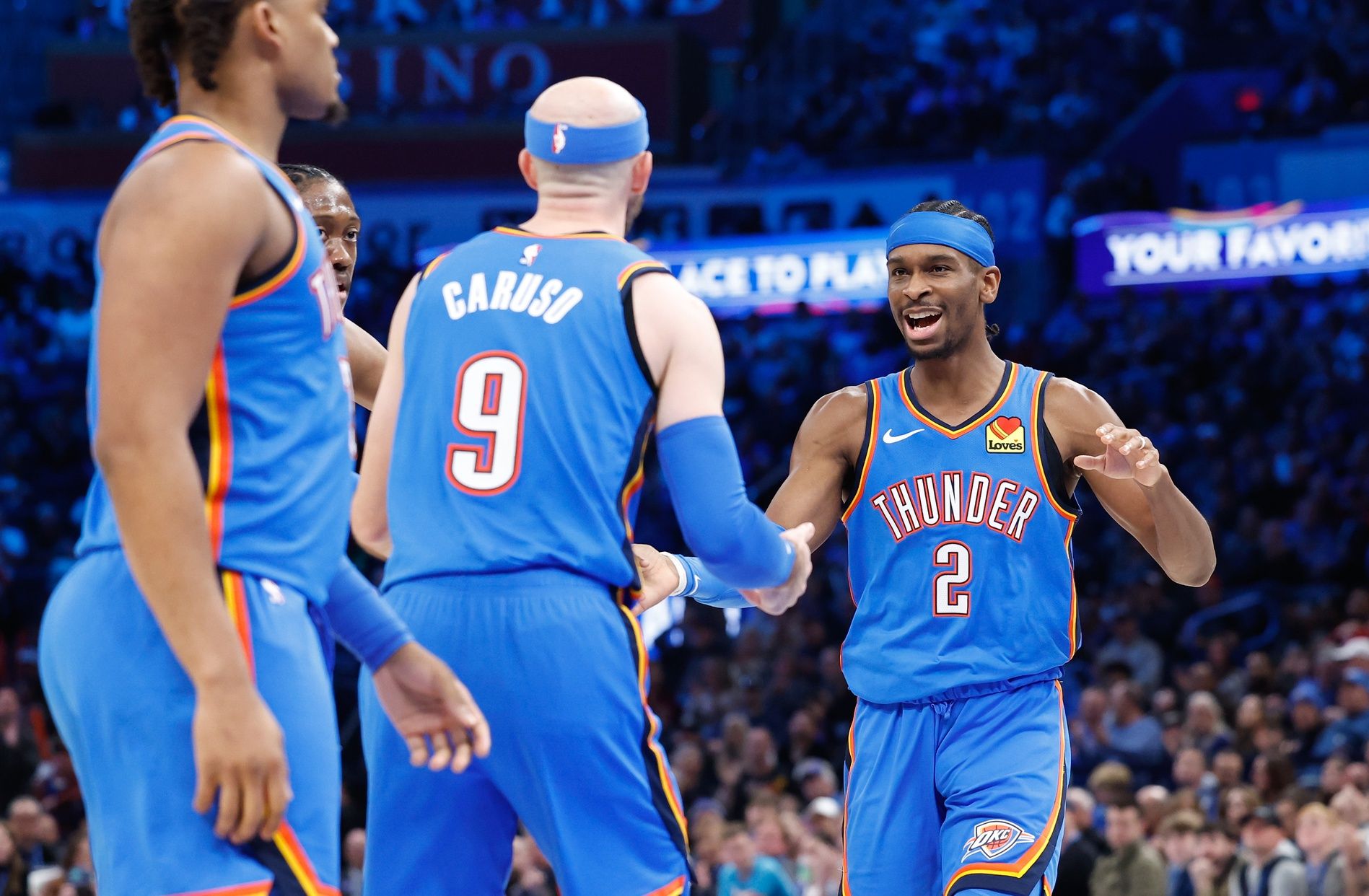 Oklahoma City Thunder guard Shai Gilgeous-Alexander (2) celebrates with guard Alex Caruso (9) after a basket against the Dallas Mavericks during the second half at Paycom Center.