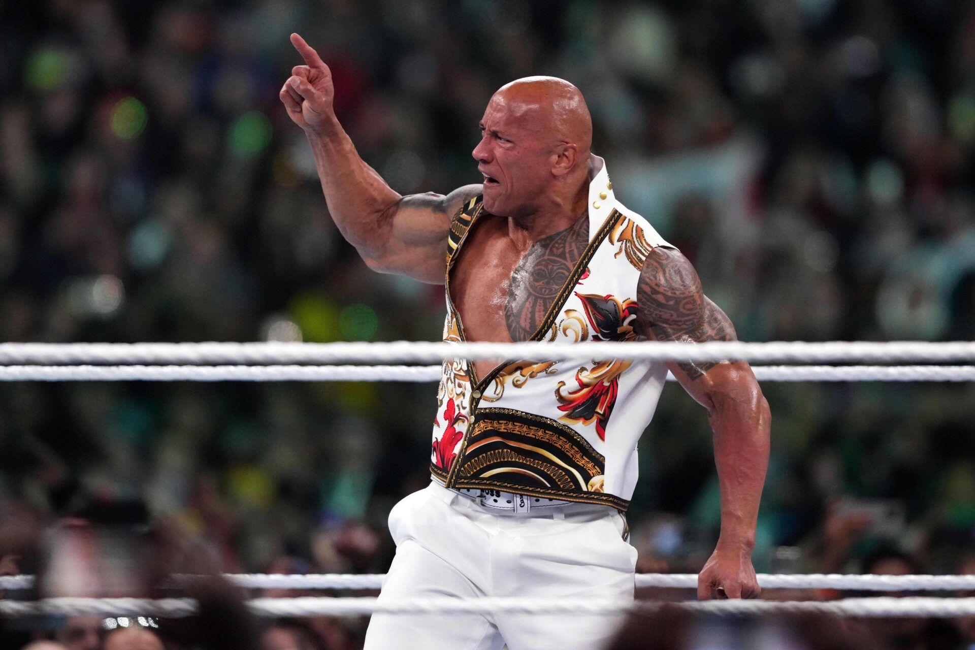 The Rock interferes during the WWE Universal Championship match between Roman Reigns and Cody Rhodes during Wrestlemania XL Sunday at Lincoln Financial Field.