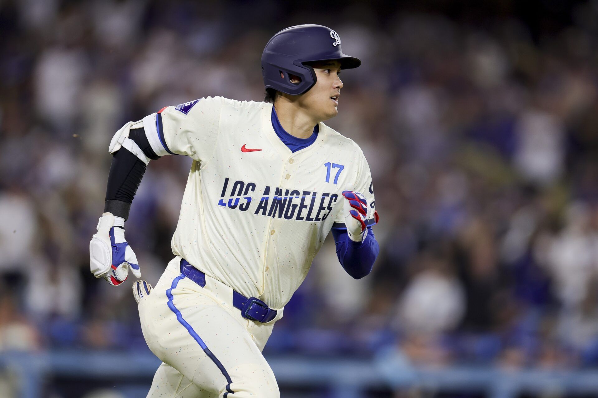 Los Angeles Dodgers designated hitter Shohei Ohtani runs after hitting a solo home-run during the sixth inning of a baseball game against the San Francisco Giants at Dodger Stadium.