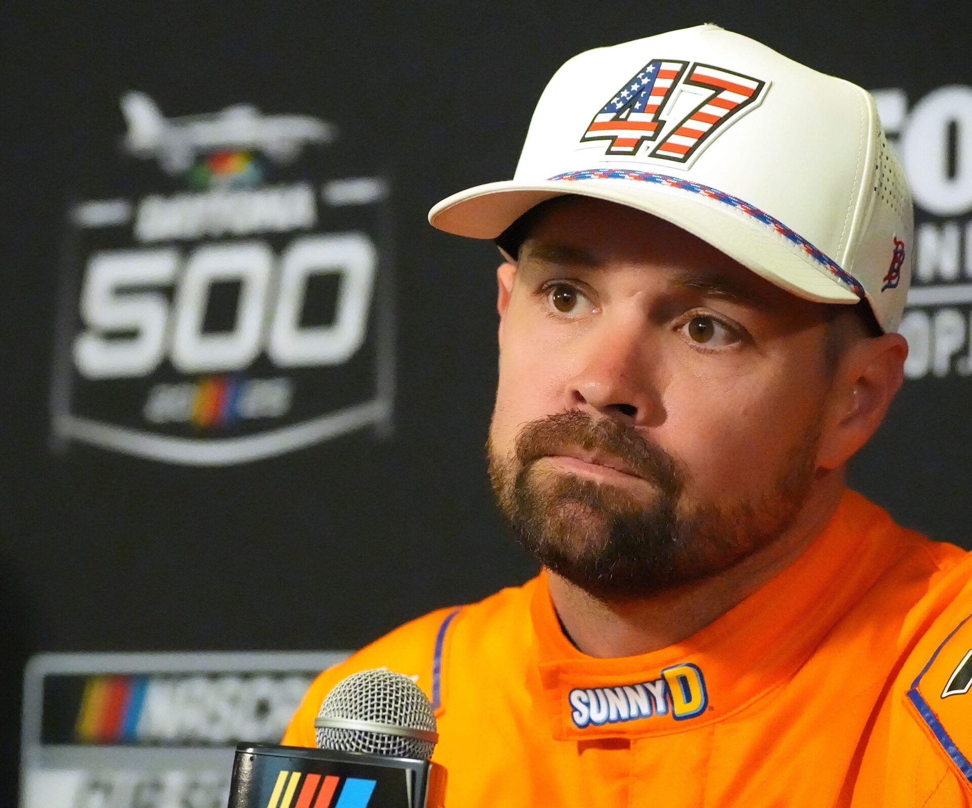 Ricky Stenhouse Jr. talks with reporters, Wednesday February 12, 2025 during Media Day for the Daytona 500.