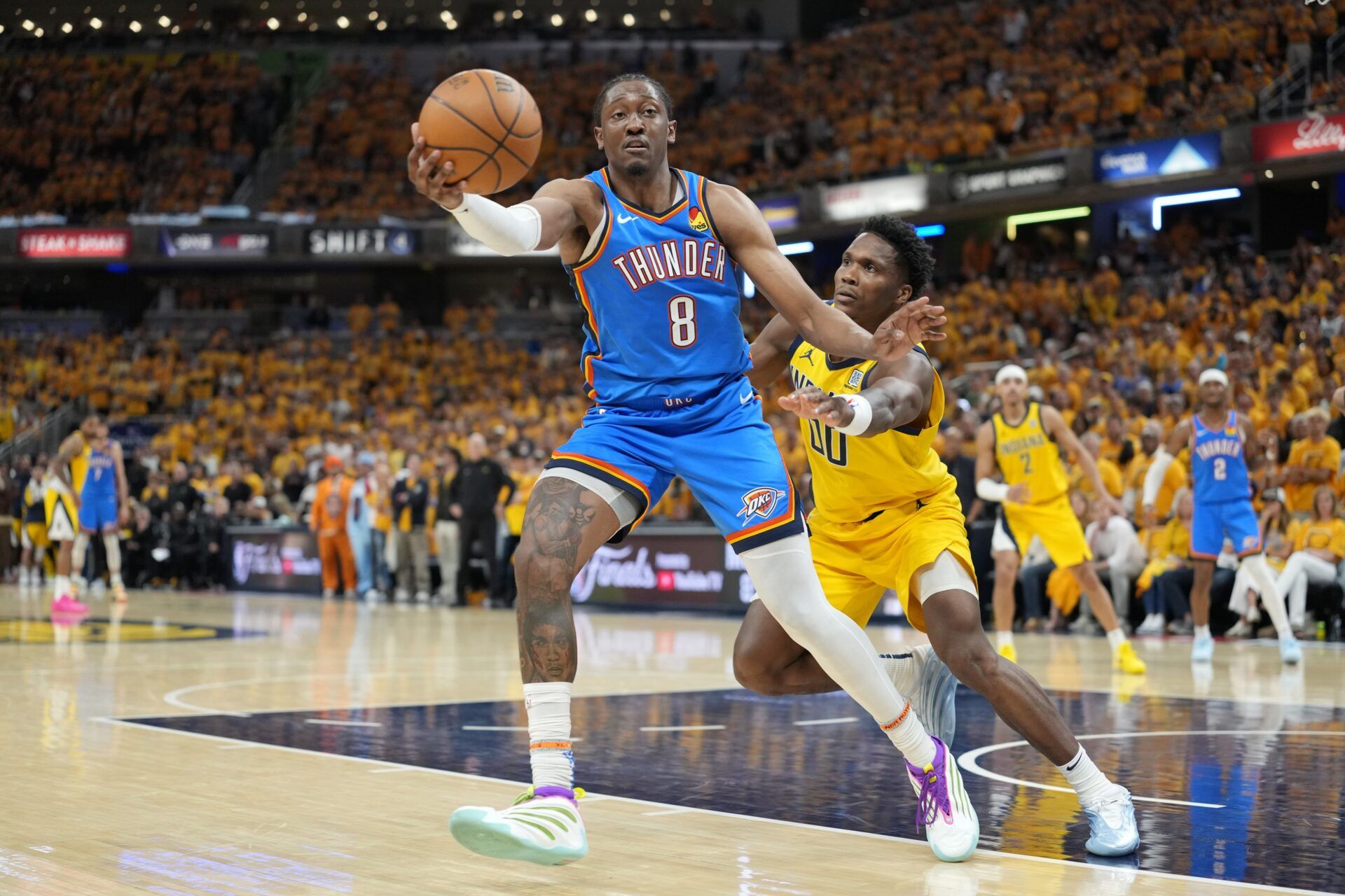 Oklahoma City Thunder forward Jalen Williams (8) controls the ball against Indiana Pacers guard Bennedict Mathurin (00) during the second half during game four of the 2025 NBA Finals at Gainbridge Fieldhouse.