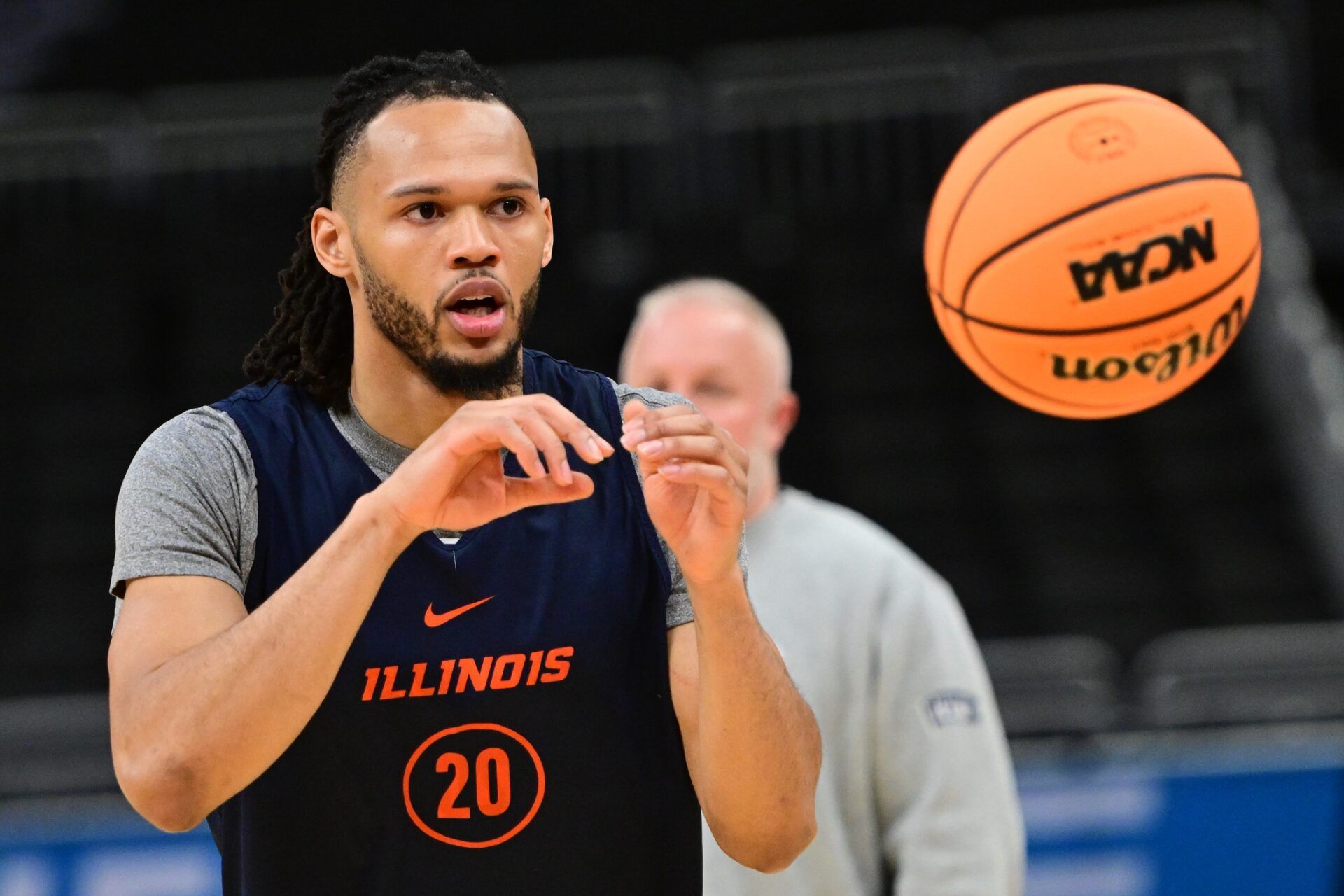 Illinois Fighting Illini guard Ty Rodgers (20) works out during NCAA Tournament First Round Practice at Fiserv Forum.