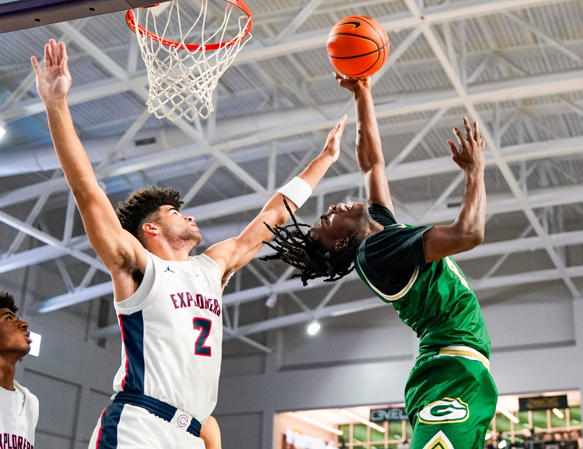 Grayson Rams guard Caleb Holt (3) makes an acrobatic lay up attempt while being guarded by Columbus Explorers guard Cayden Boozer (2) during the first quarter of a City of Palms Classic quarterfinal game at Suncoast Credit Union Arena in Fort Myers, Fla., on Friday, Dec. 20, 2024.
