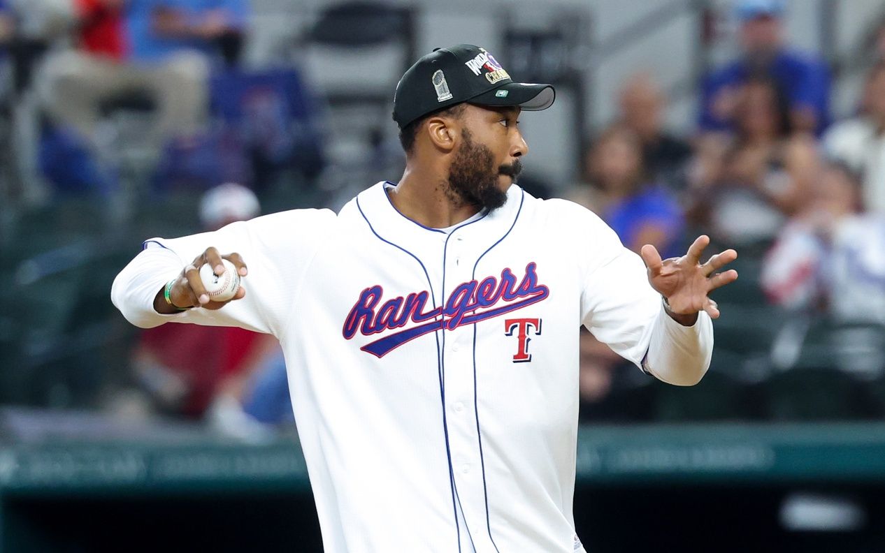 Cleveland Browns defensive end Myles Garrett throws the ceremonial first pitch before the game between the Texas Rangers and Chicago White Sox at Globe Life Field.
