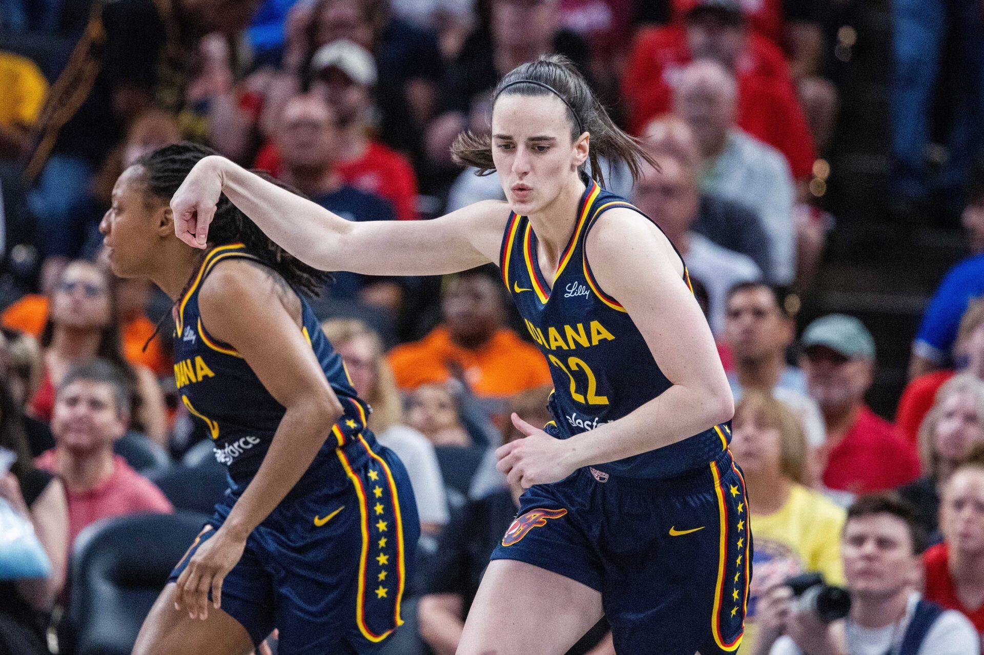 Indiana Fever guard Caitlin Clark (22) celebrates a made basket  in the second half against the New York Liberty at Gainbridge Fieldhouse.