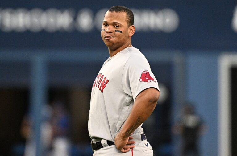 Boston Red Sox third baseman Rafael Devers (11) reacts after popping out against the Toronto Blue Jays in the fifth inning at Rogers Centre.