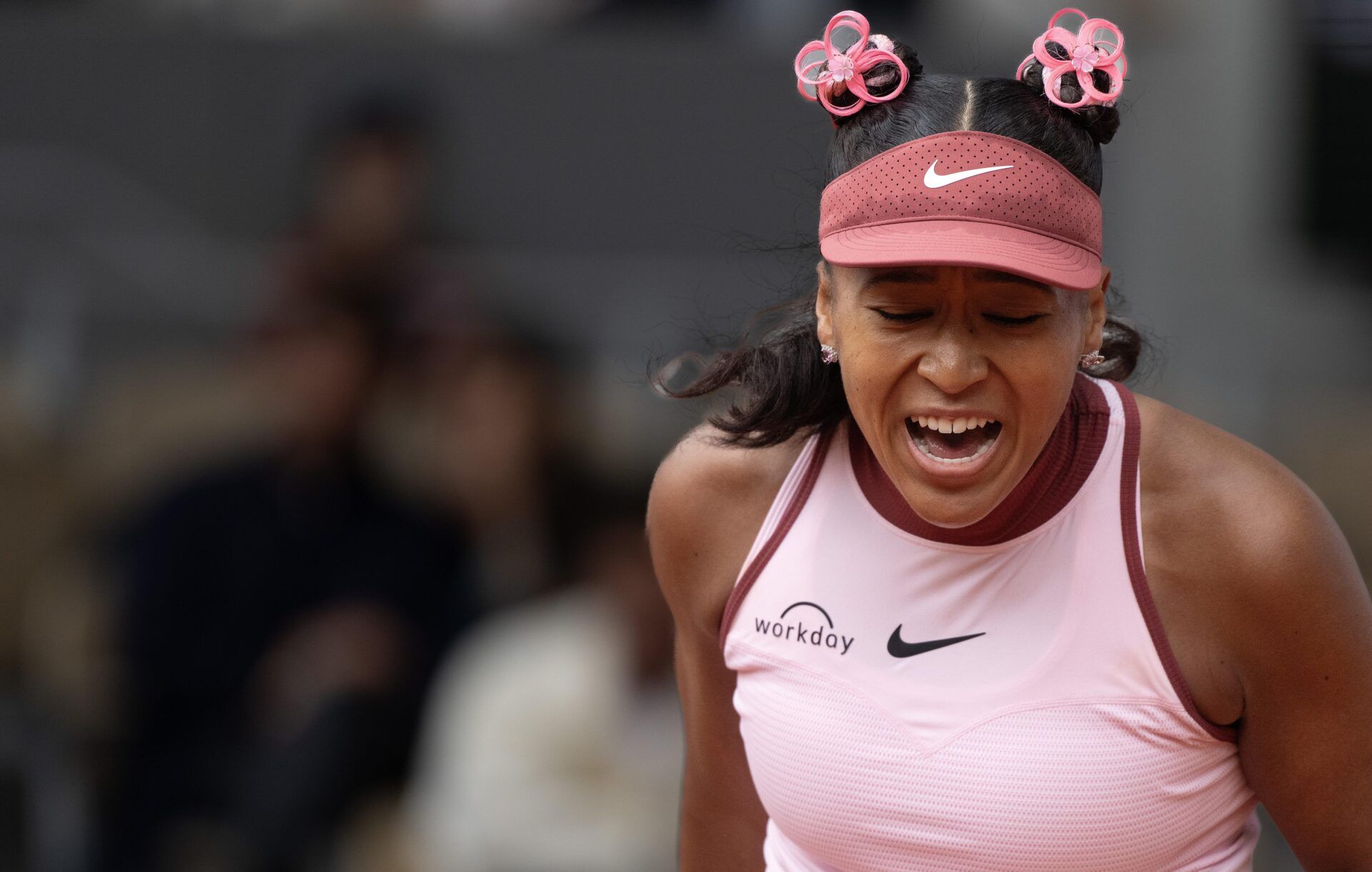 Naomi Osaka of Japan reacts to a point during her match against Paula Badosa of Spain on day two at Roland Garros Stadium.