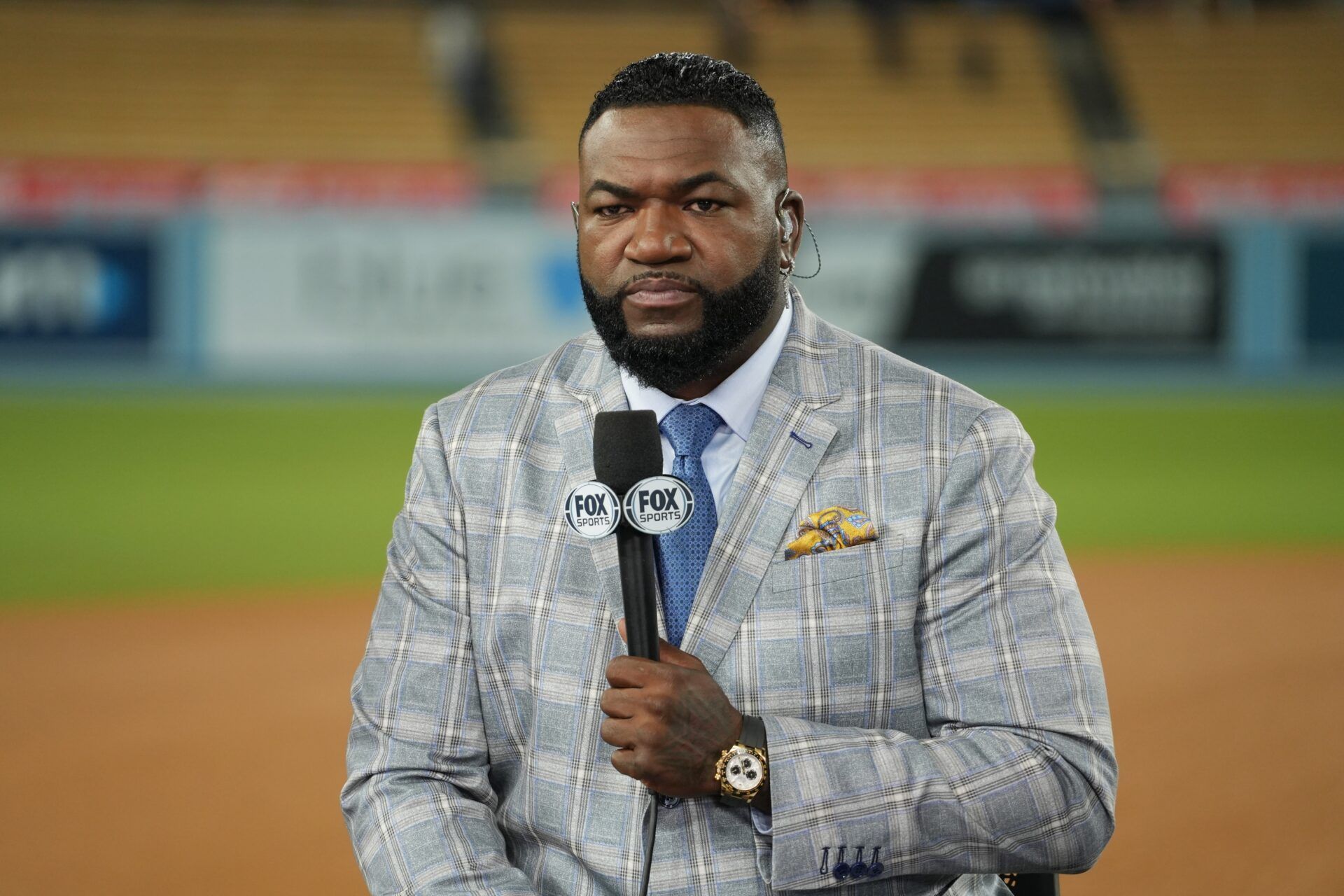 Fox Sports broadcaster David Ortiz speaks on field after game two between the Los Angeles Dodgers and the New York Yankees in the 2024 MLB World Series at Dodger Stadium.