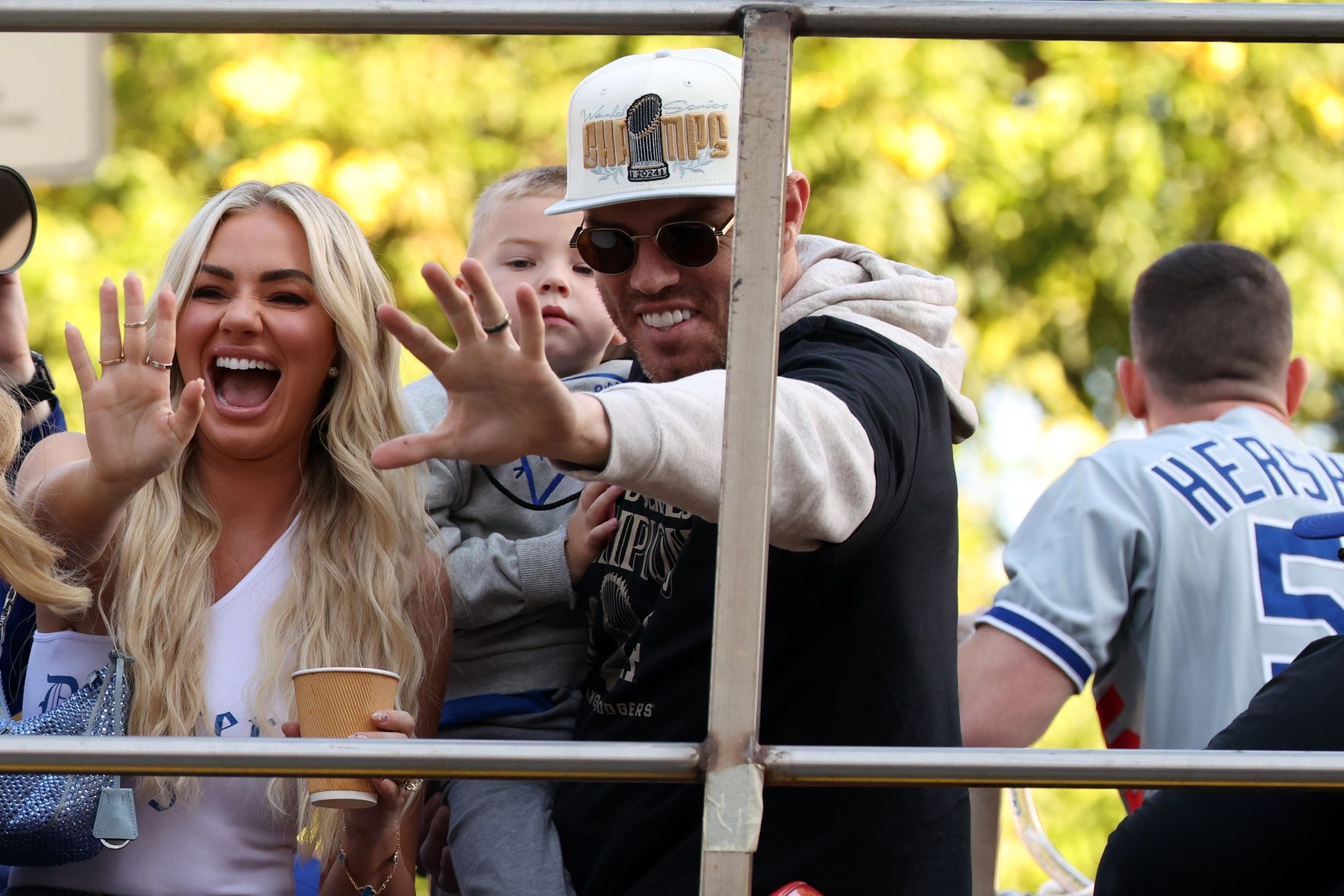 Los Angeles Dodgers first base Freddie Freeman (right) celebrates with his wife Chelsea Freeman during the 2024 World Series Championship parade in downtown Los Angeles.