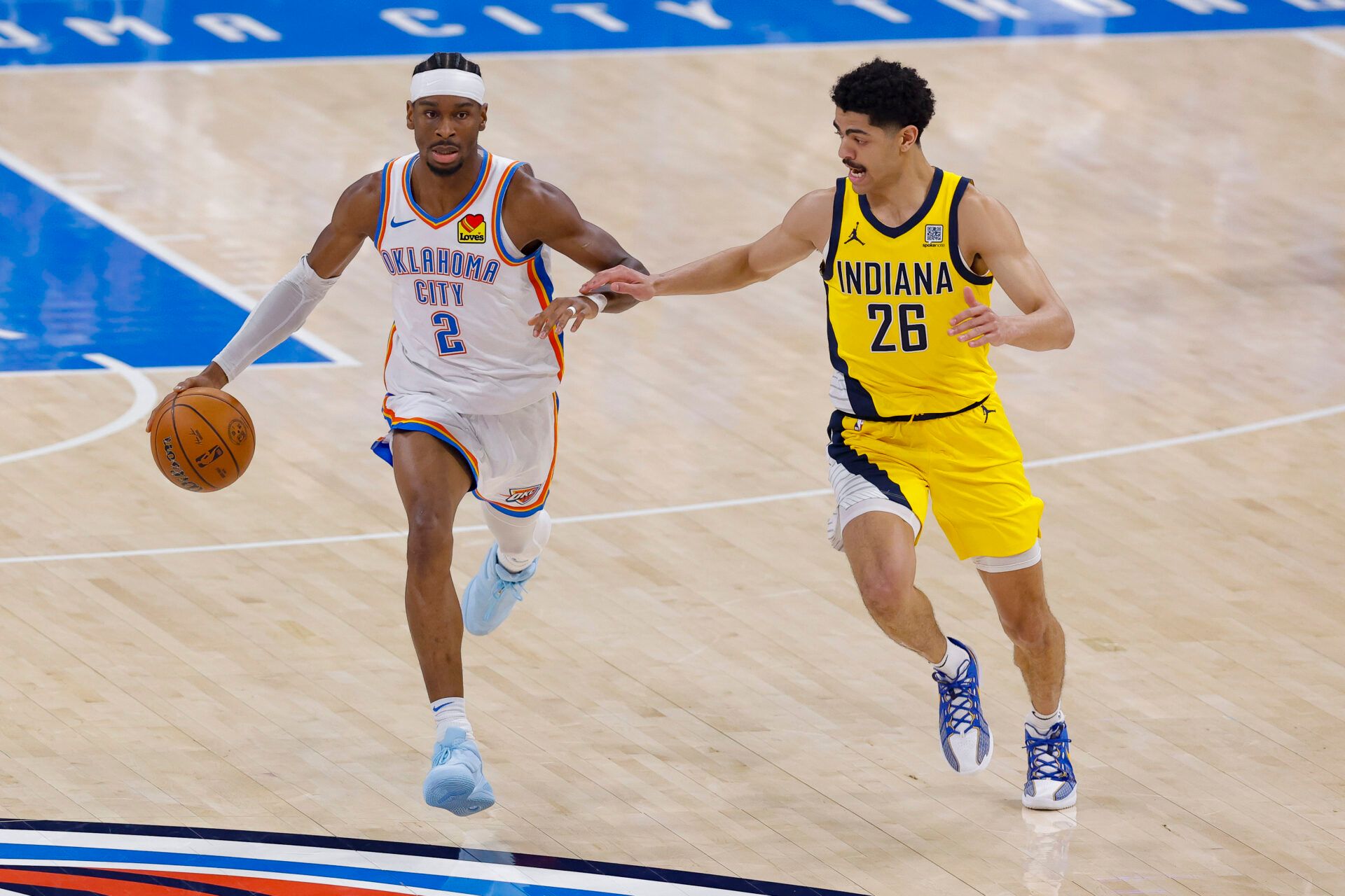 Oklahoma City Thunder guard Shai Gilgeous-Alexander (2) brings the ball up court past Indiana Pacers guard Ben Sheppard (26) in the first quarter during game five of the 2025 NBA Finals at Paycom Center.