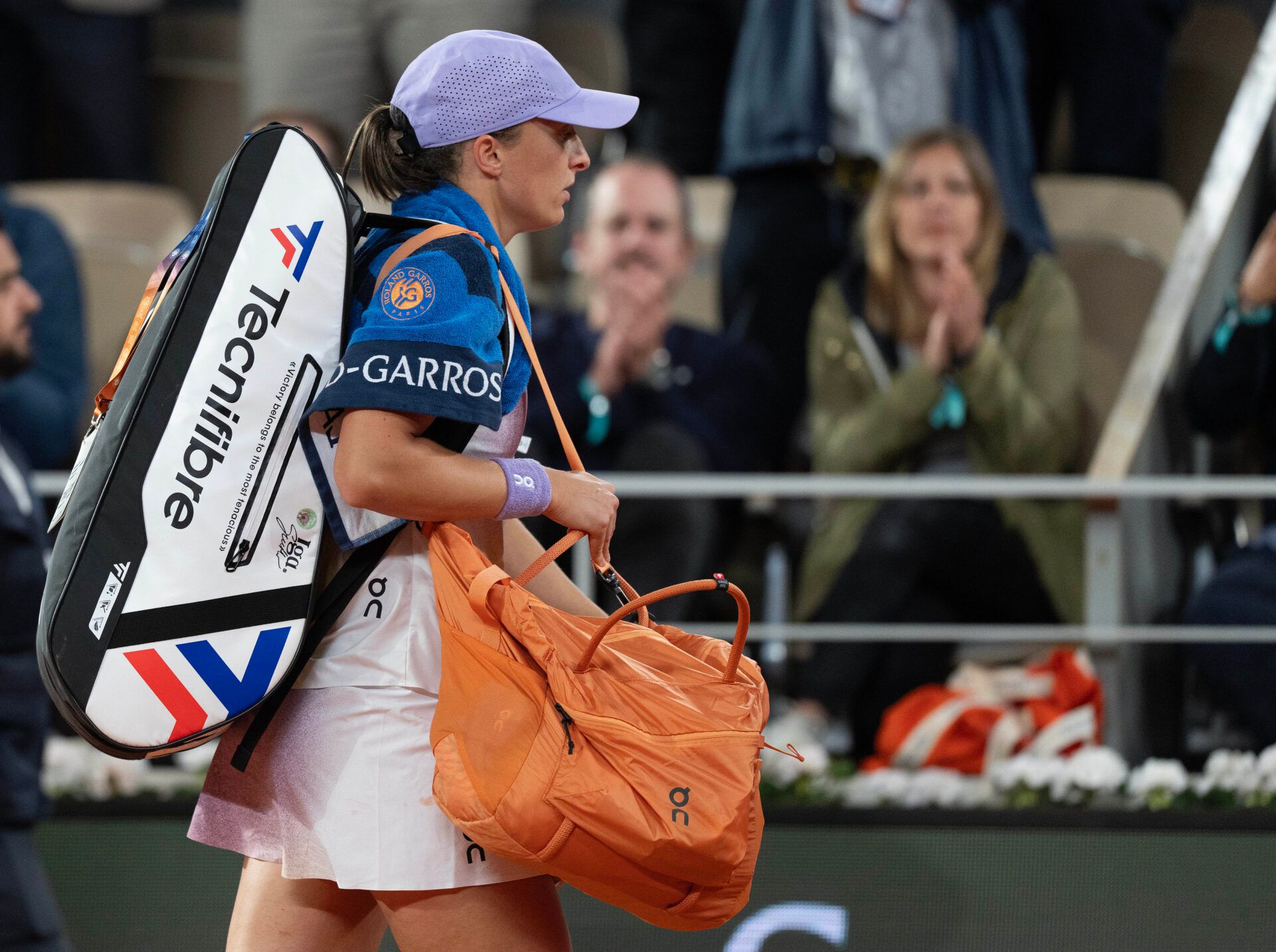 Iga Swiatek of Poland leaves the court after losing her match against Aryna Sabalenka on day 12 at Roland Garros Stadium.