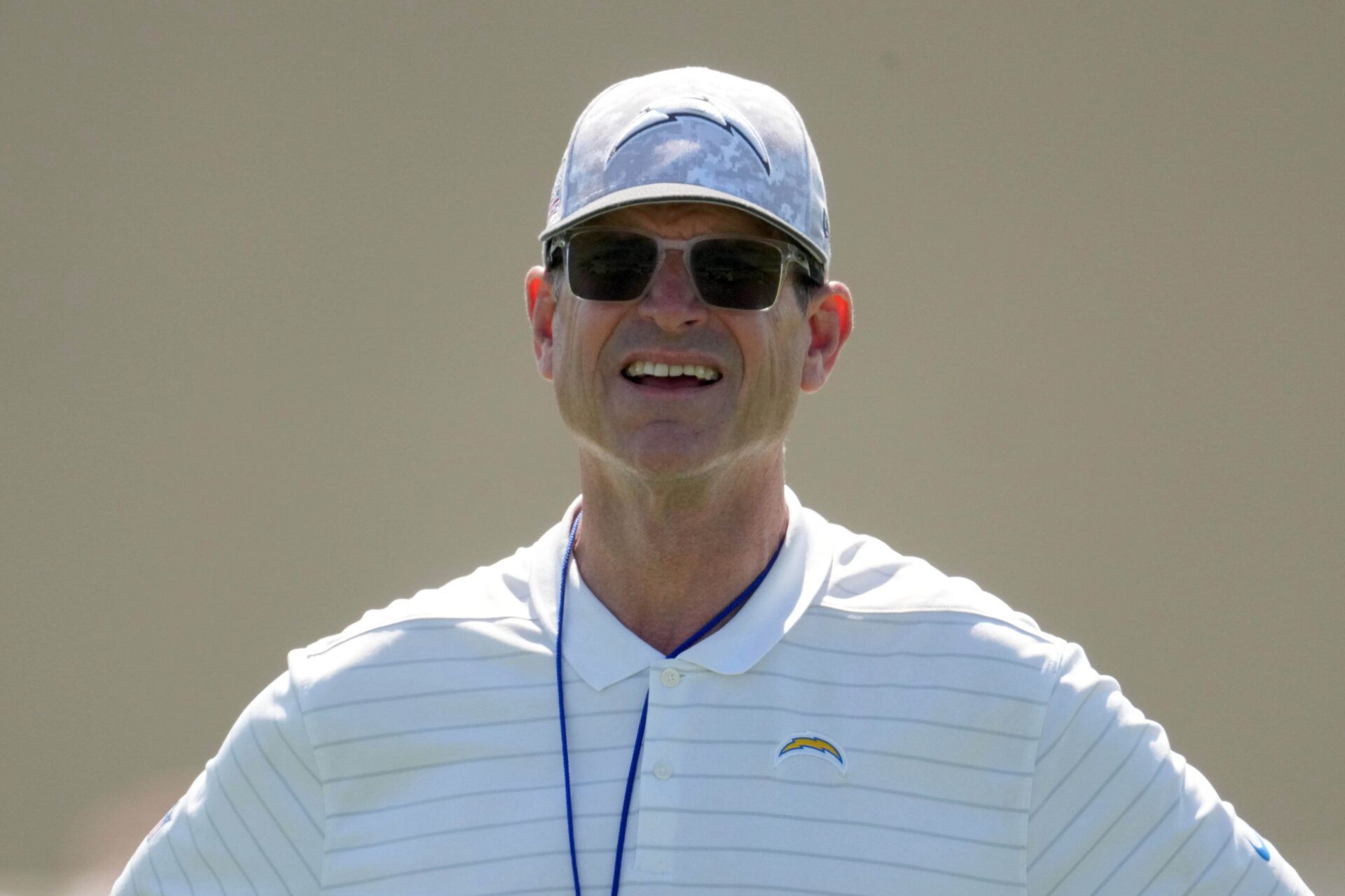 Los Angeles Chargers coach Jim Harbaugh looks on during offseason workouts at The Bolt.