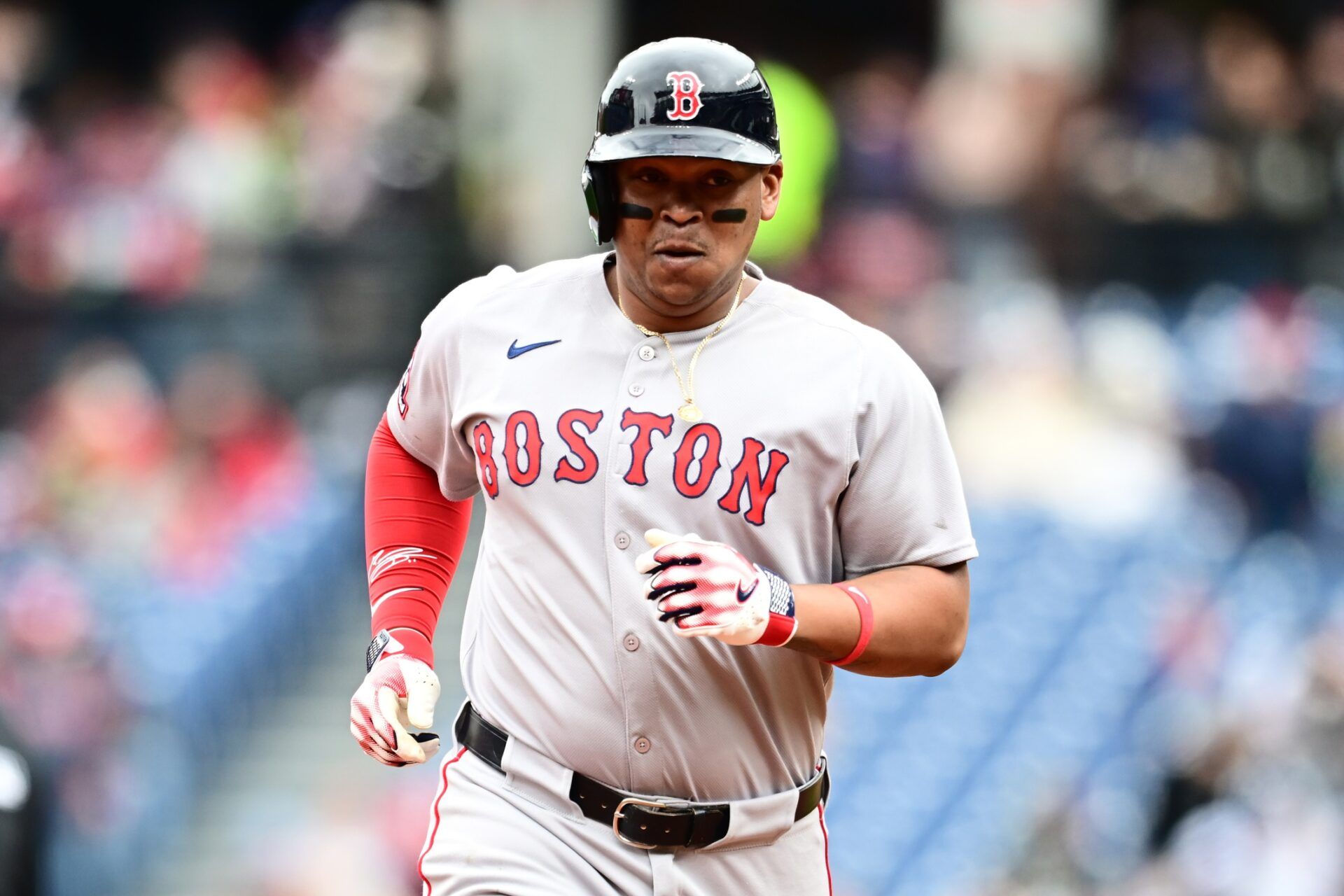 Boston Red Sox designated hitter Rafael Devers (11) rounds the bases after hitting a home run during the third inning against the Cleveland Guardians at Progressive Field.