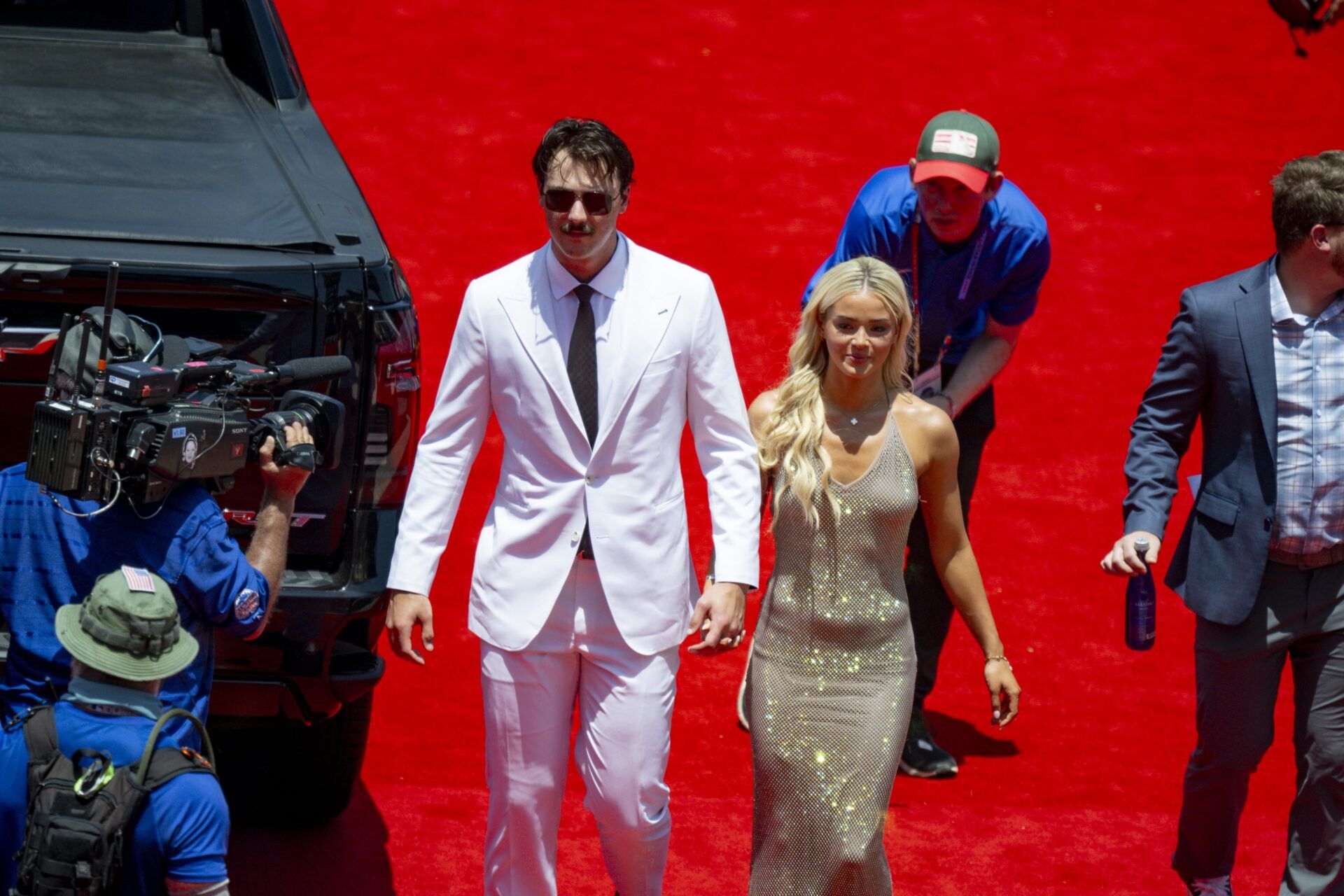 National League pitcher Paul Skenes of the Pittsburgh Pirates walks the red carpet with his girlfriend LSU gymnast Olivia Livvy Dunne before the 2024 MLB All-Star game at Globe Life Field.