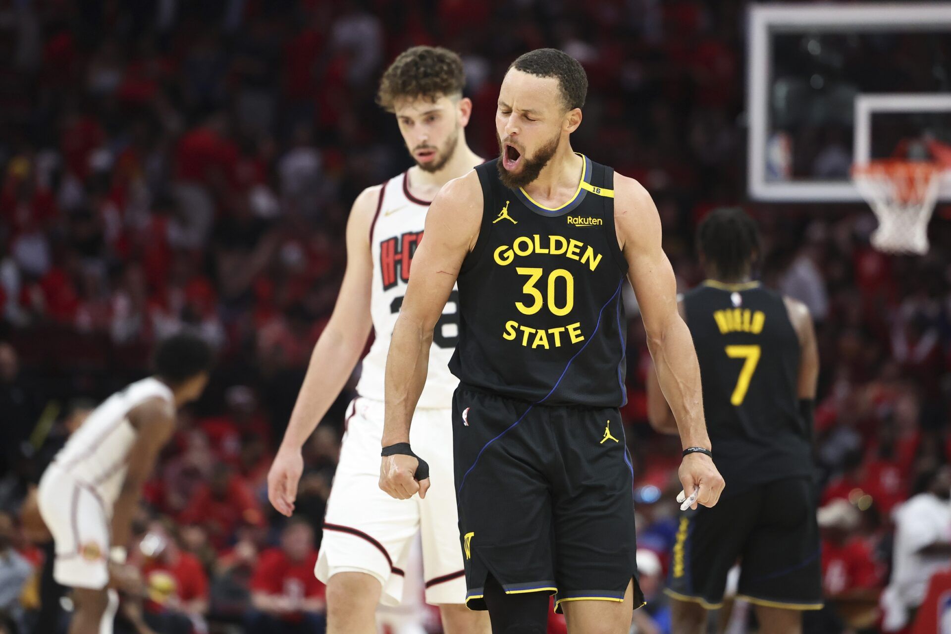 Golden State Warriors guard Stephen Curry (30) reacts after a play during game seven of the first round for the 2025 NBA Playoffs against the Houston Rockets at Toyota Center.