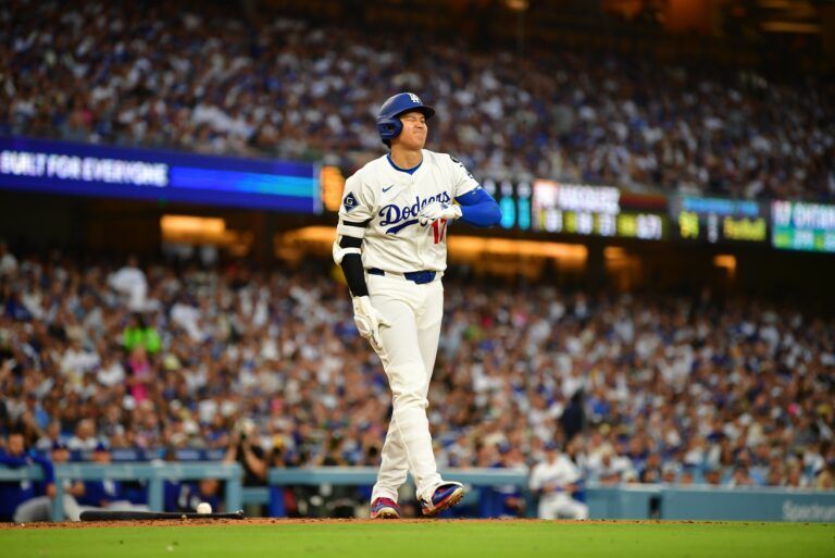 Los Angeles Dodgers designated hitter Shohei Ohtani (17) reacts after being hit by a pitch during the third inning against the San Diego Padres at Dodger Stadium.